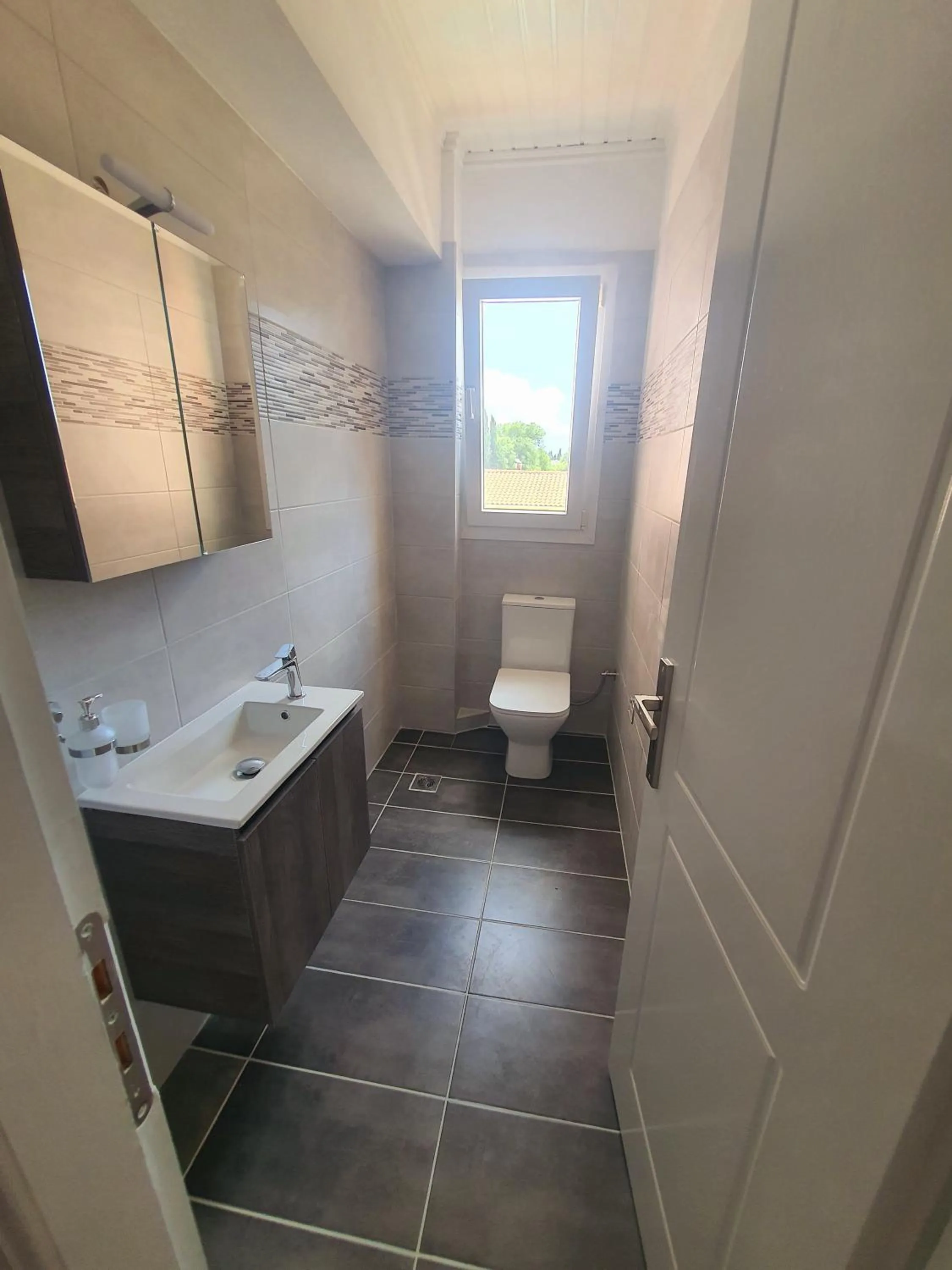 Toilet in BELLA De LUX APTS