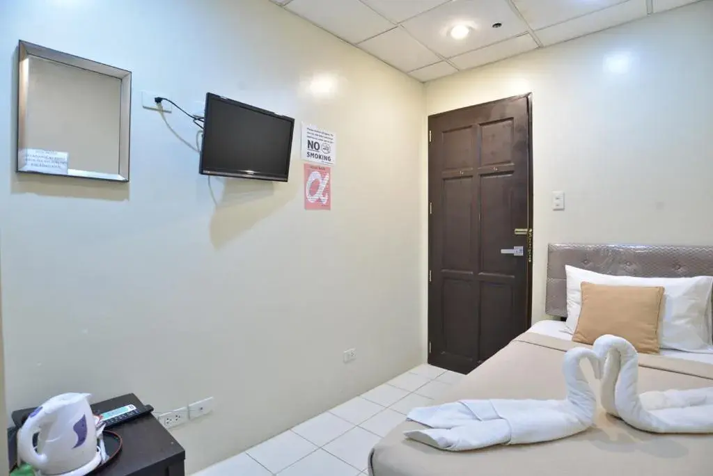 Standard Single Room with Shared Bathroom in Amax Inn Makati Standard Single Room with Shared Bathroom in Amax Inn Makati