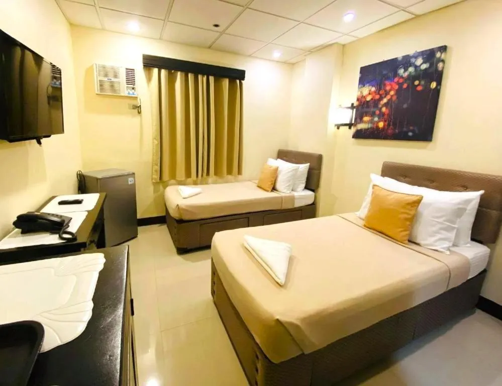 Bed in Amax Inn Makati