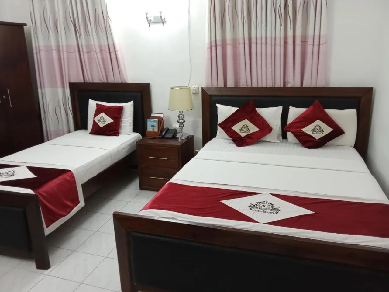 Bed in Asian Grand Hotel