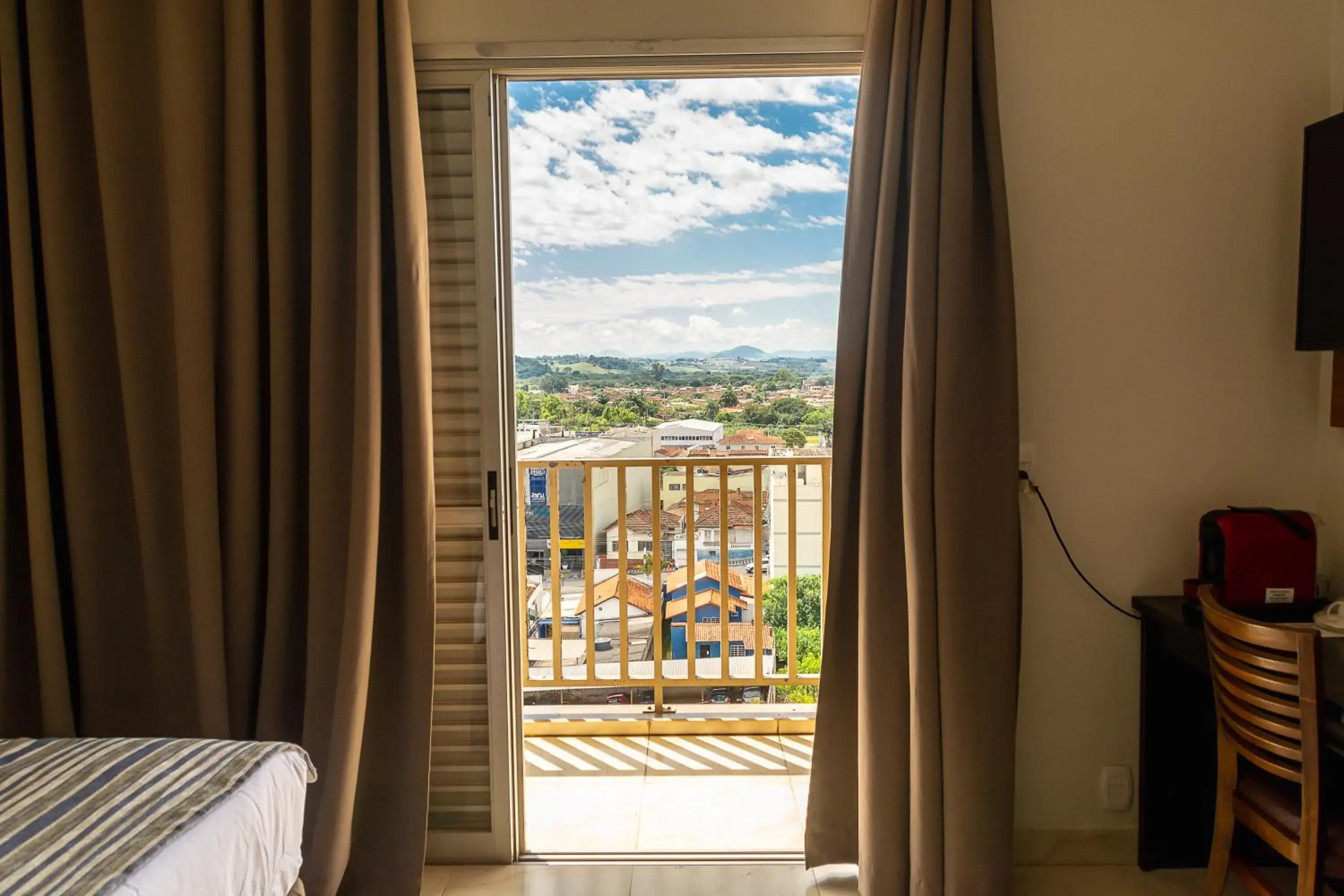 View (from property/room), Bed in Fenix Hotel Pouso Alegre View (from property/room), Bed in Fenix Hotel Pouso Alegre