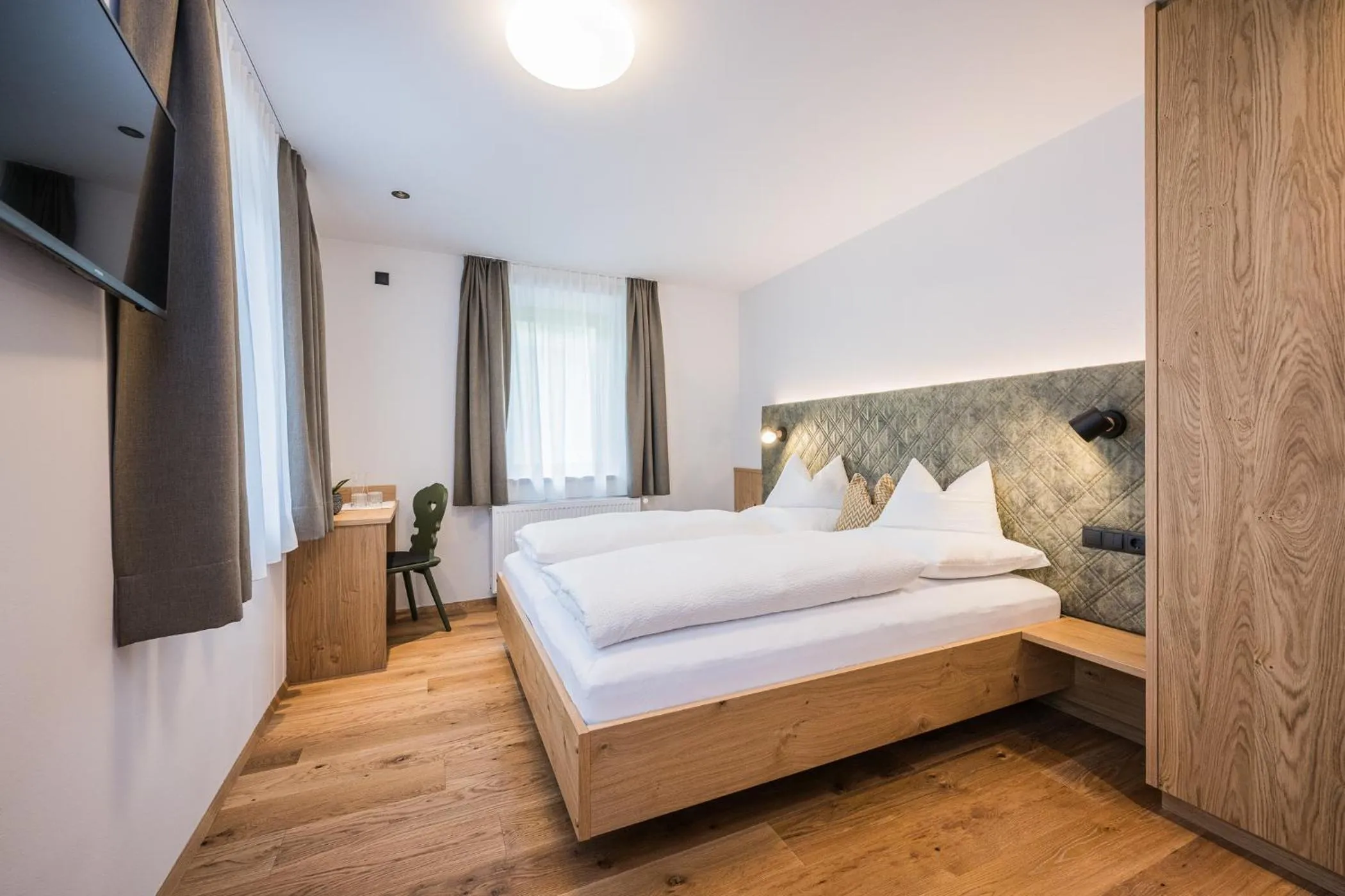 Bed in Gasthof Albergo Dolomiten