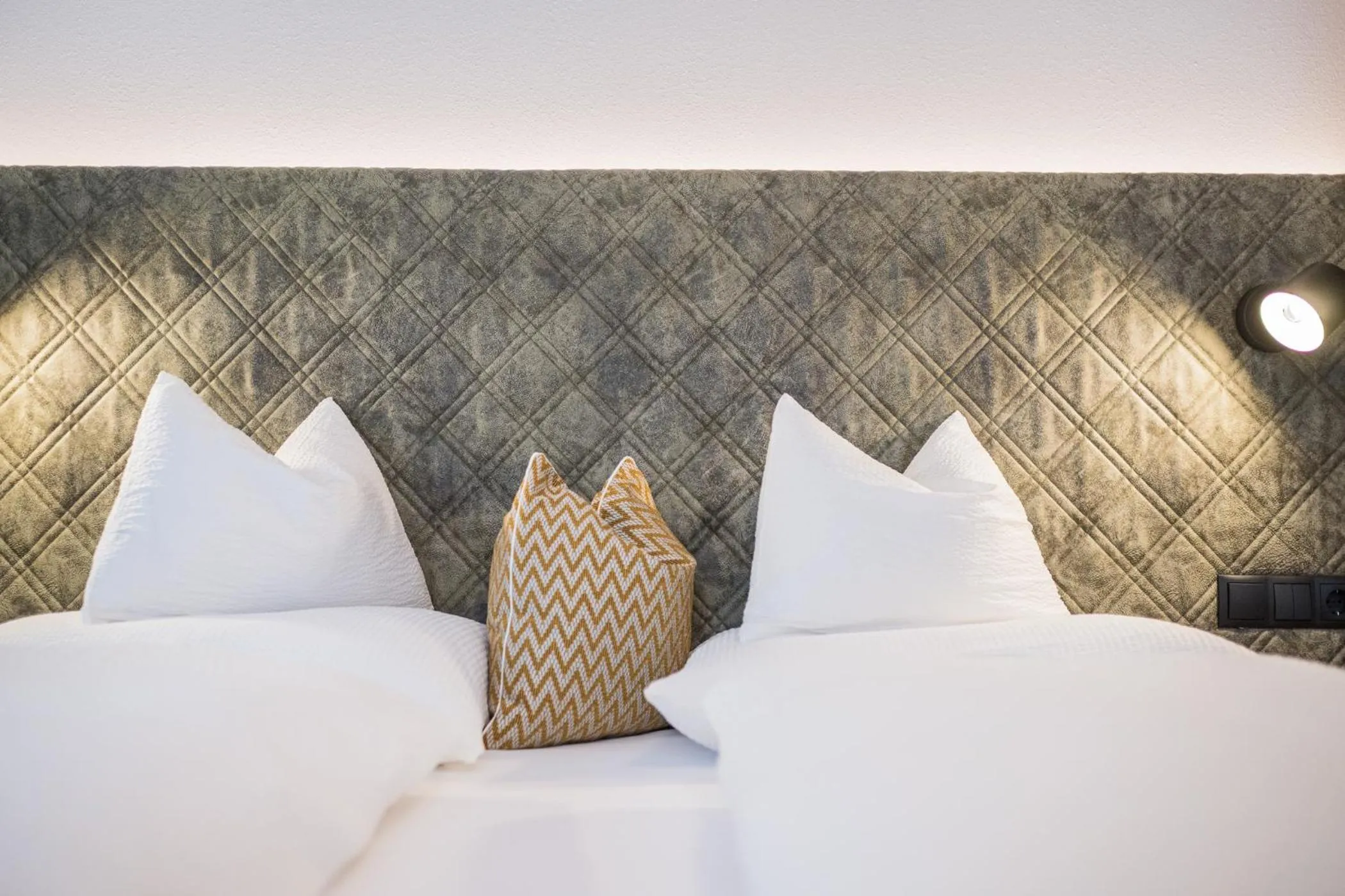 Bed in Gasthof Albergo Dolomiten