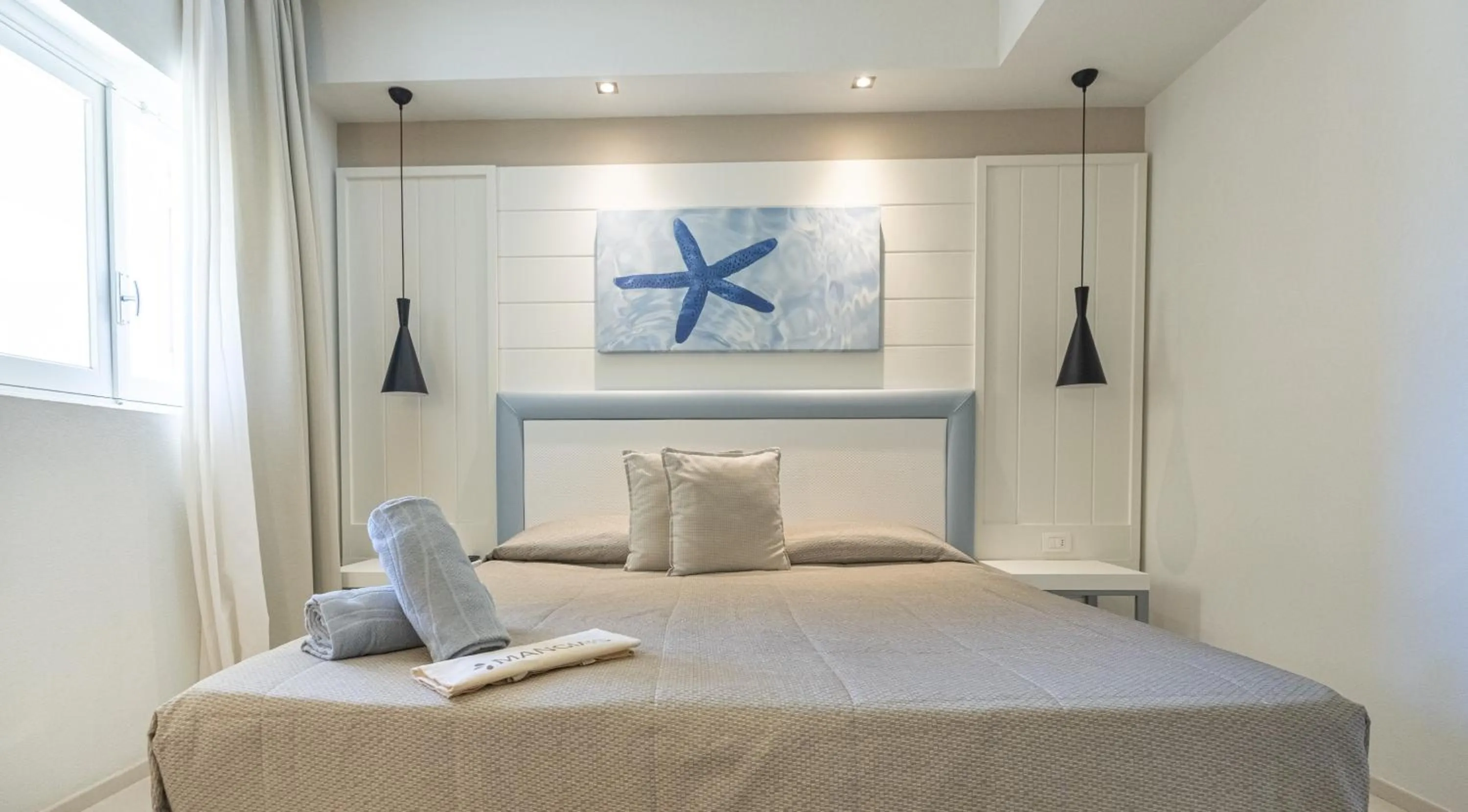 Bed in Mangia's Pollina Resort