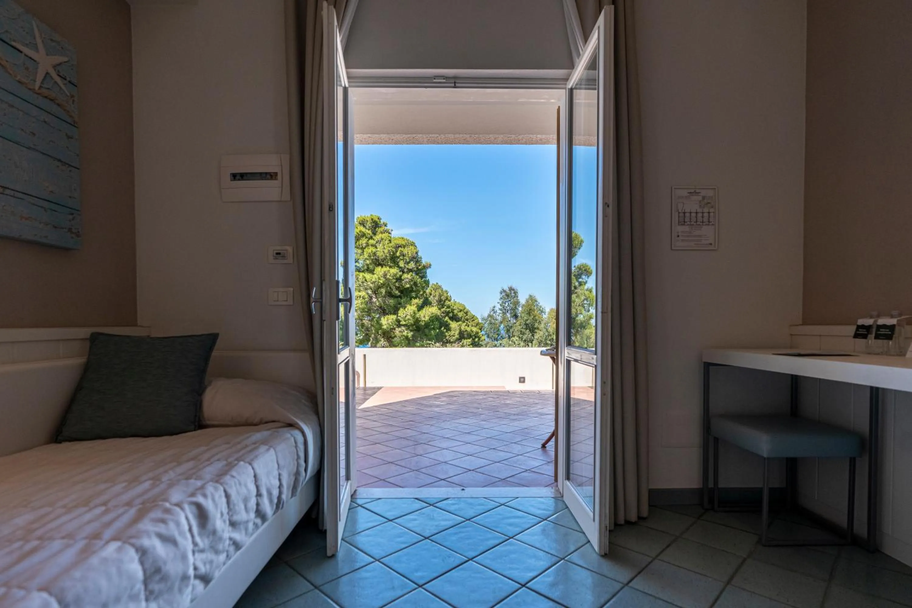 View (from property/room), Bed in Mangia's Pollina Resort