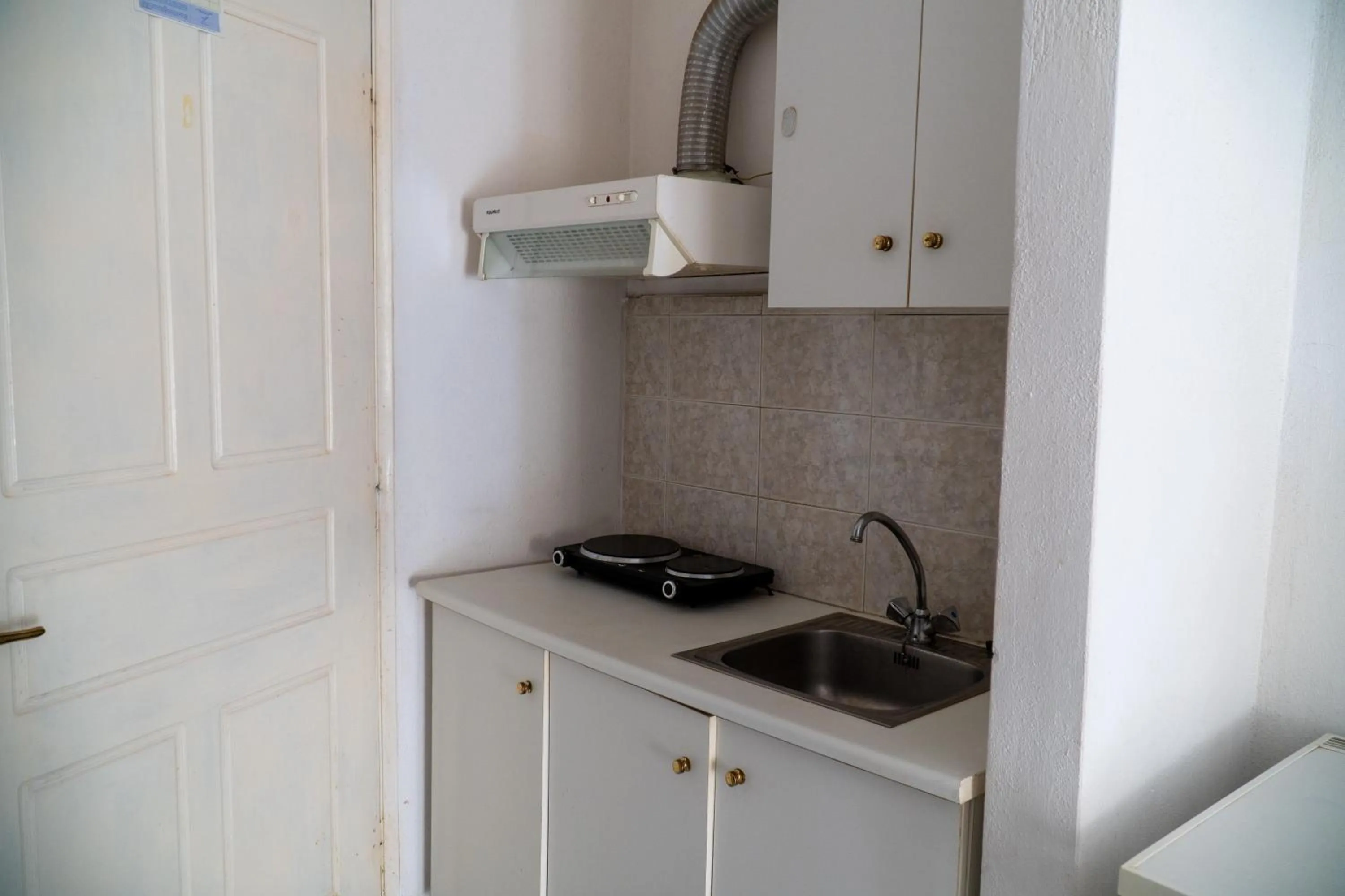 Kitchen or kitchenette in Pagona Hotel