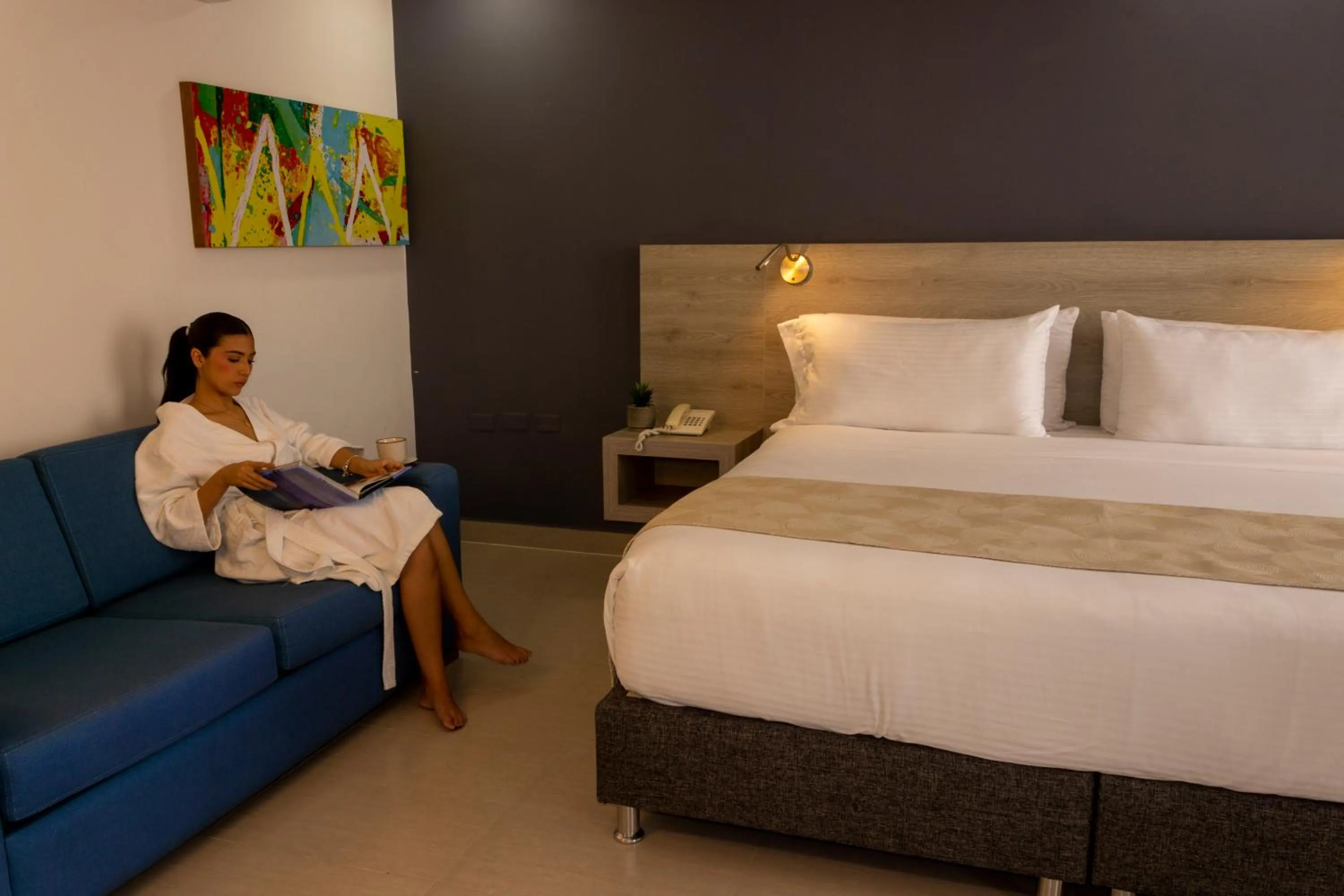 Living room, Bed in VVC Hotel's