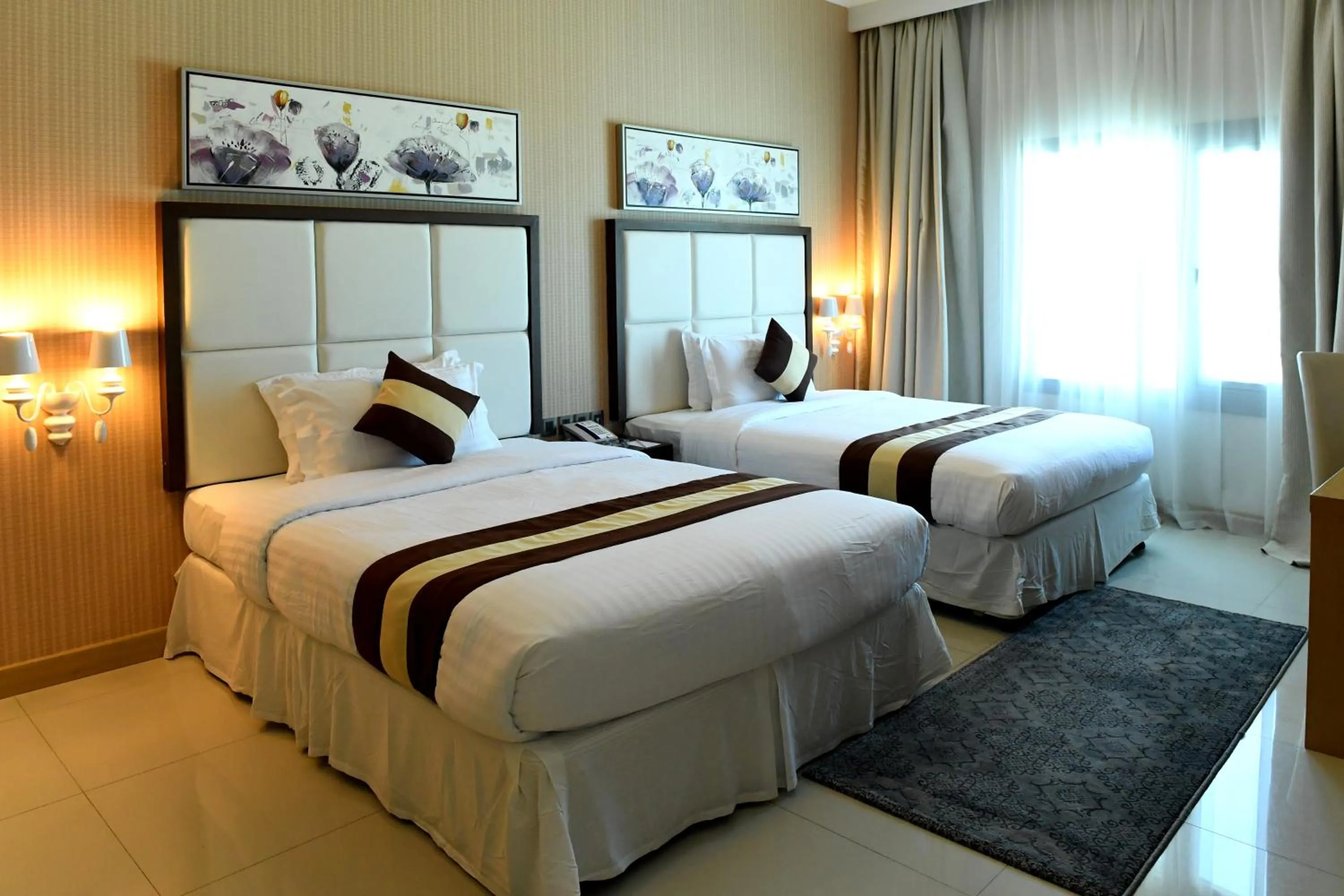Bed in Al Olaya Suites Hotel