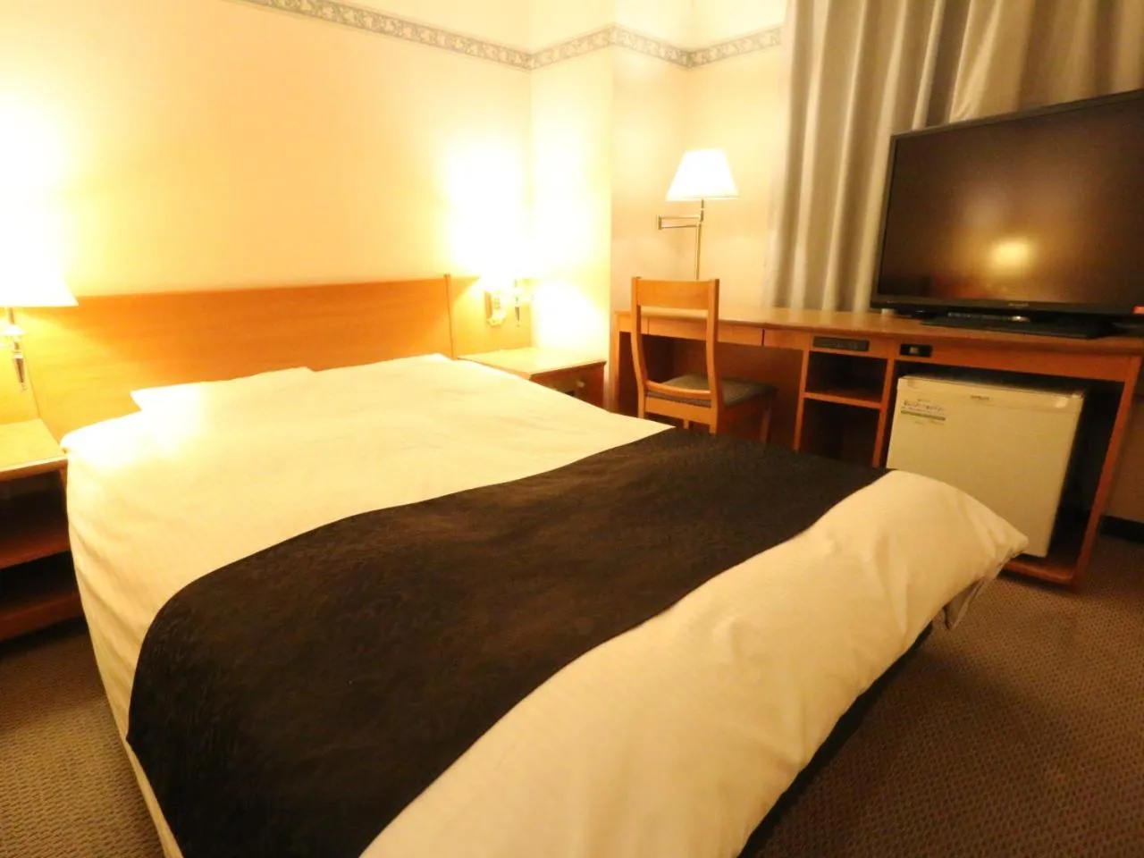Photo of the whole room, Bed in APA Hotel Fukui Katamachi