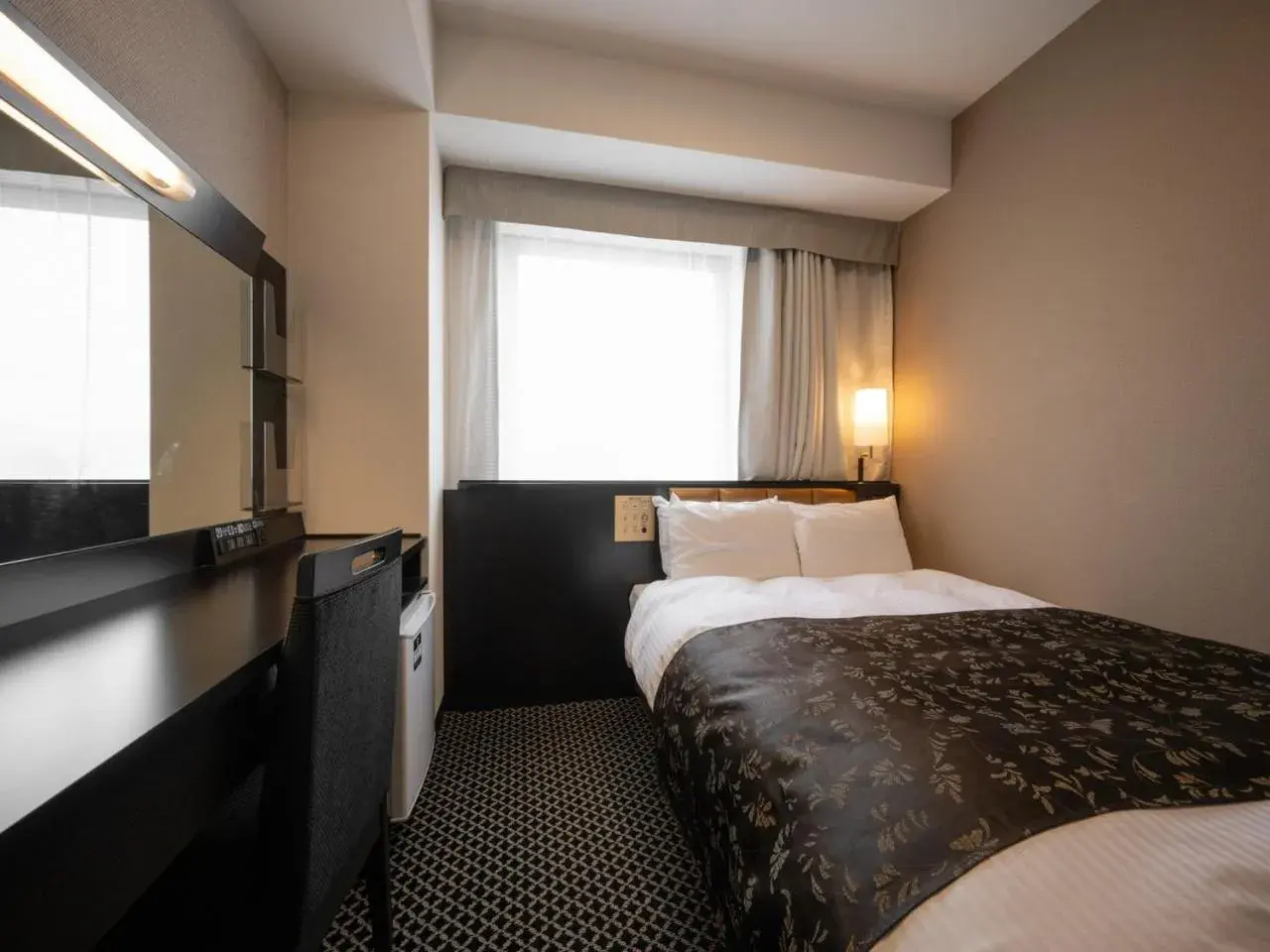 Bed in APA Hotel Fukui Katamachi Bed in APA Hotel Fukui Katamachi