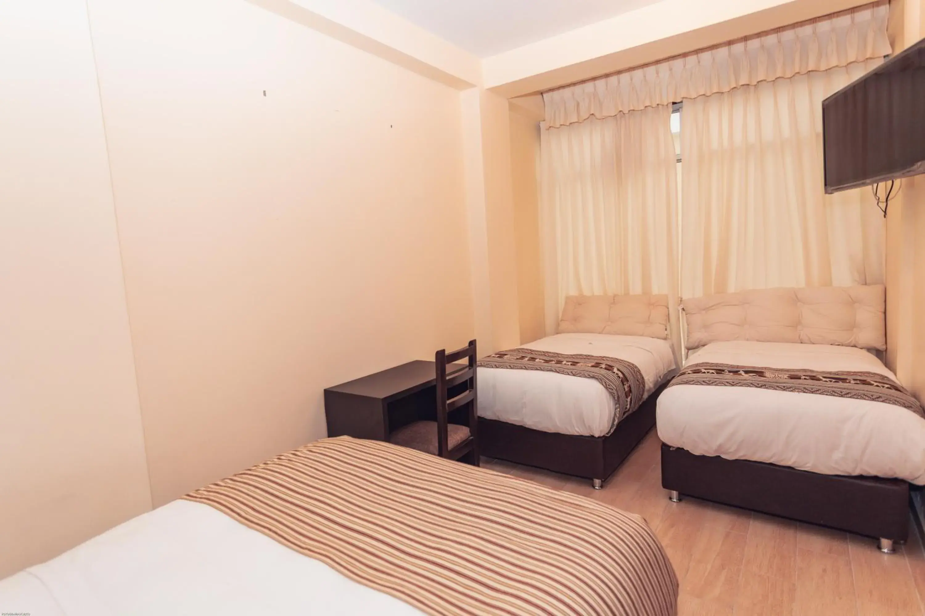 Standard Triple Room in Hotel Las Quenas Standard Triple Room in Hotel Las Quenas