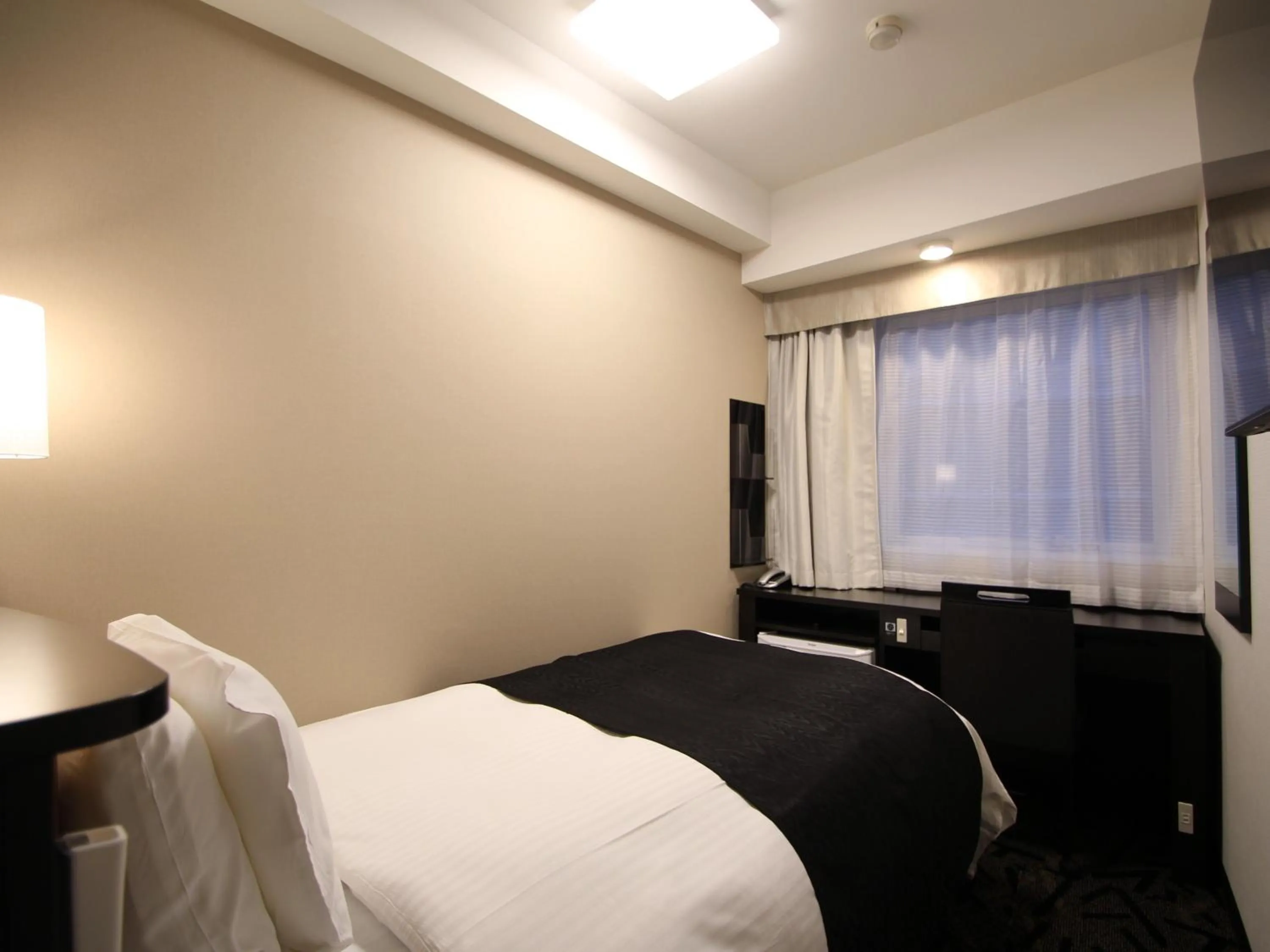 Photo of the whole room, Bed in APA Hotel Toyama Ekimae