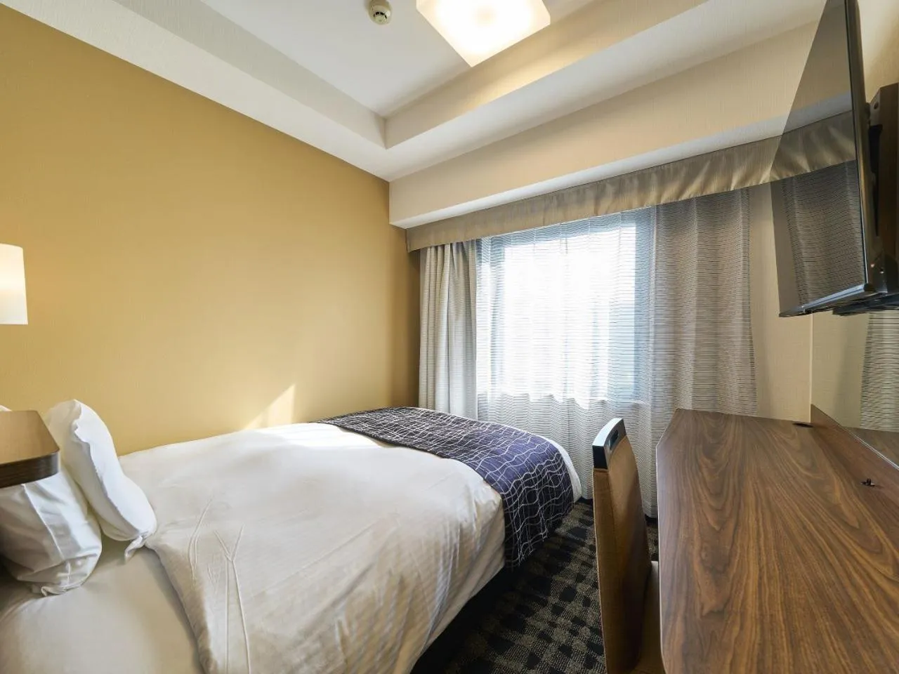 Photo of the whole room, Bed in APA Hotel Toyama Ekimae Minami
