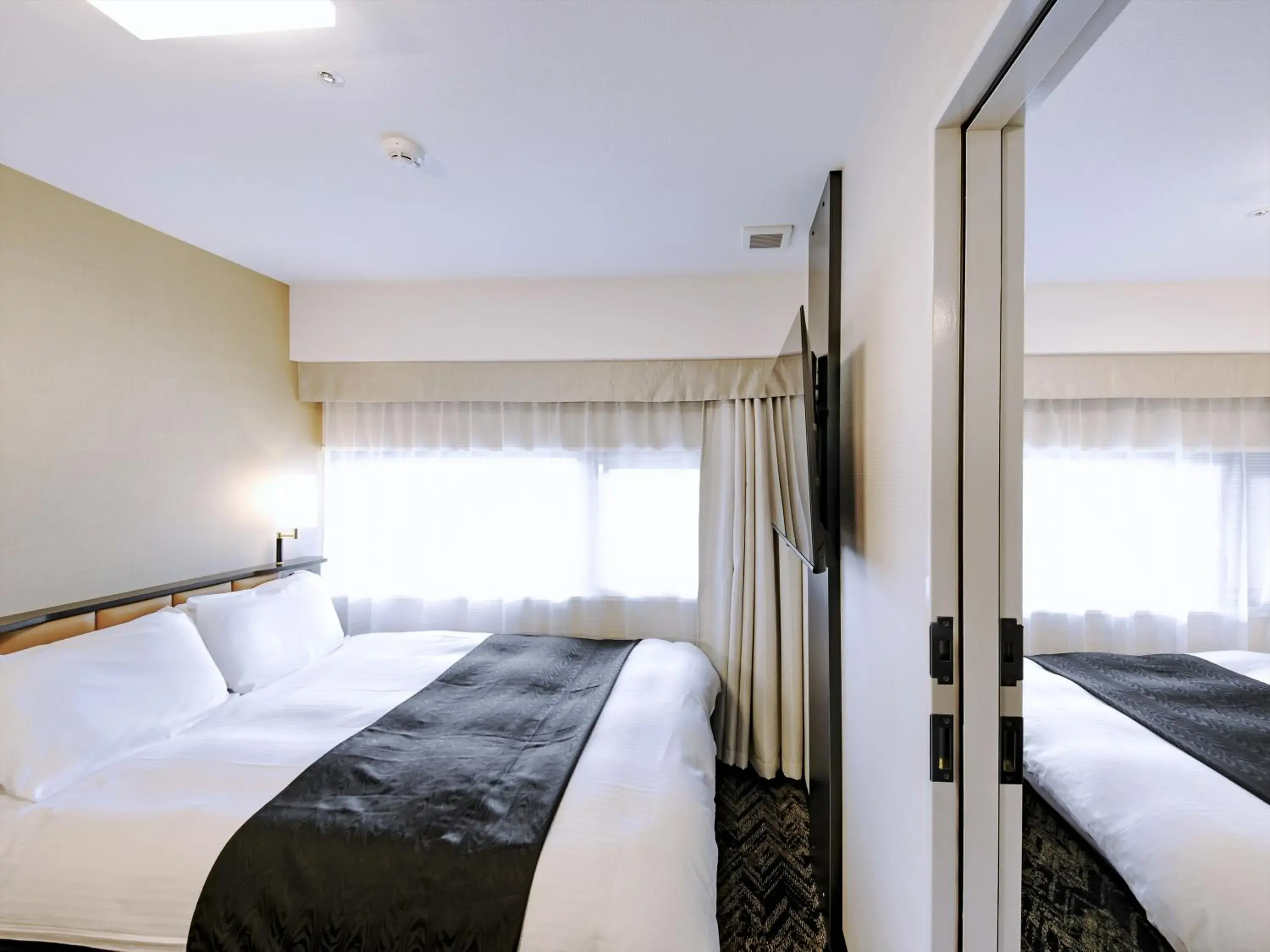 Photo of the whole room, Bed in APA Hotel Tottori Ekimae Minami Photo of the whole room, Bed in APA Hotel Tottori Ekimae Minami