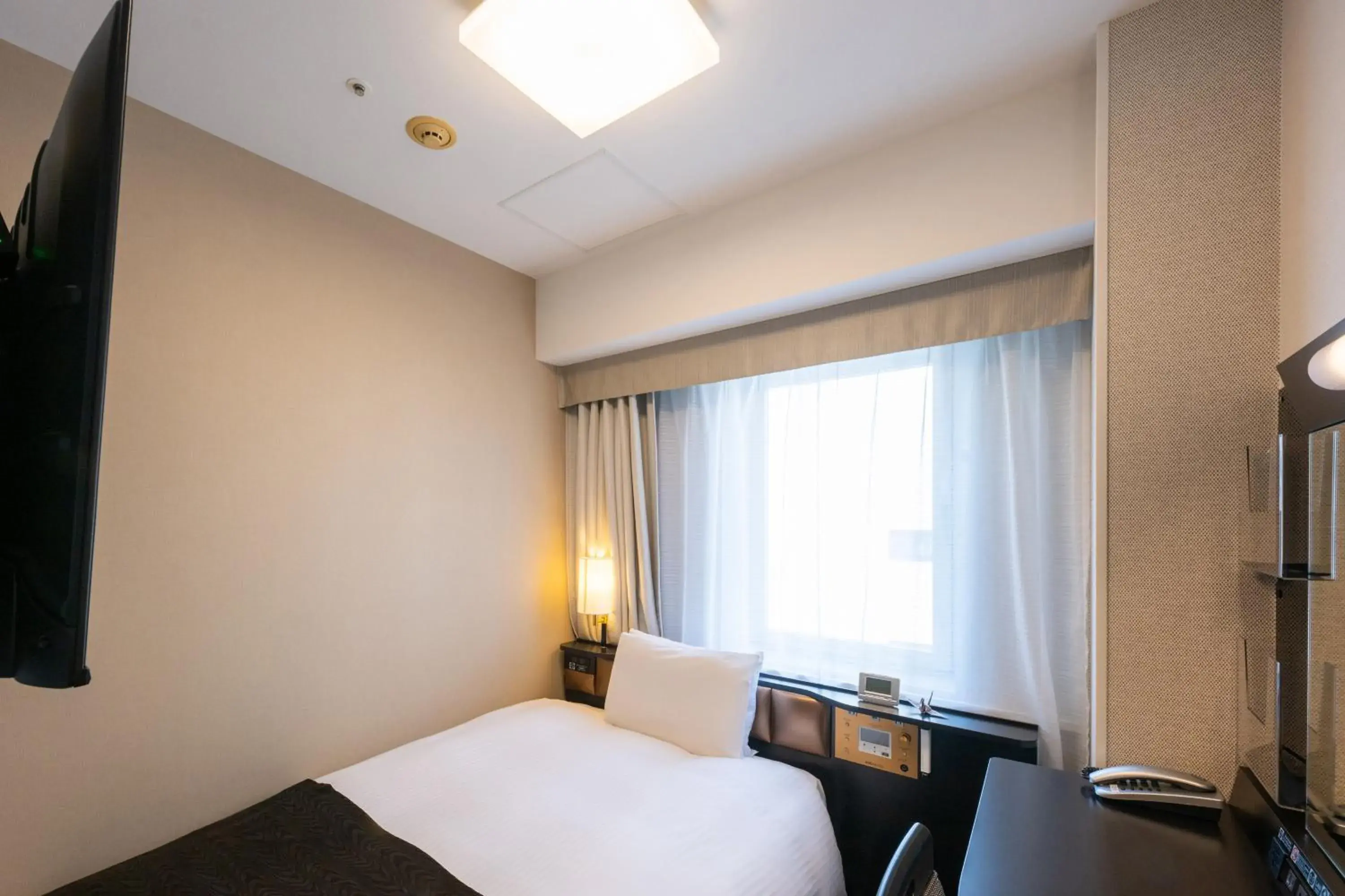 Photo of the whole room, Bed in APA Hotel Nagoya Marunouchi Ekimae Photo of the whole room, Bed in APA Hotel Nagoya Marunouchi Ekimae