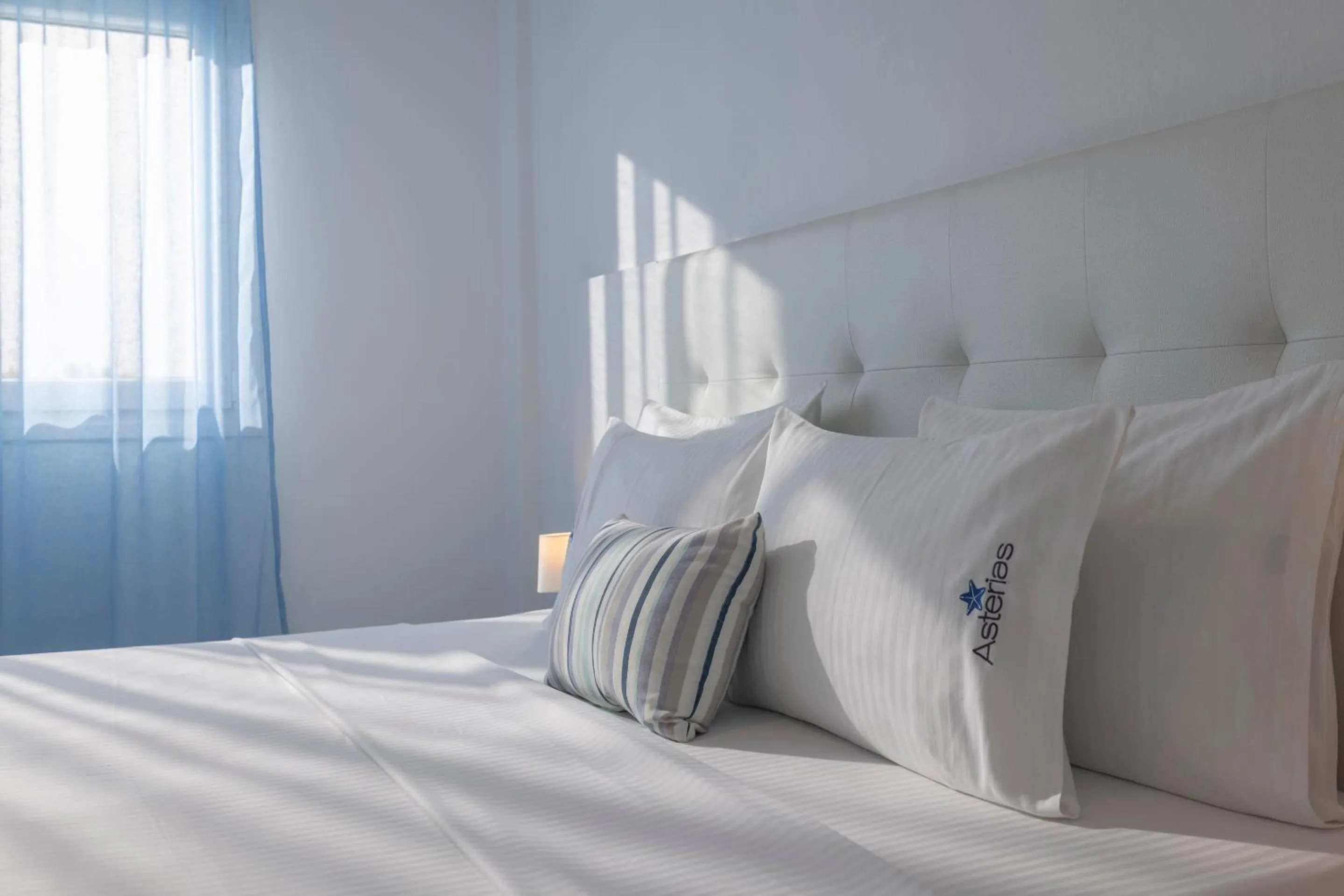 Bed in Asterias Premium Holiday Apartments