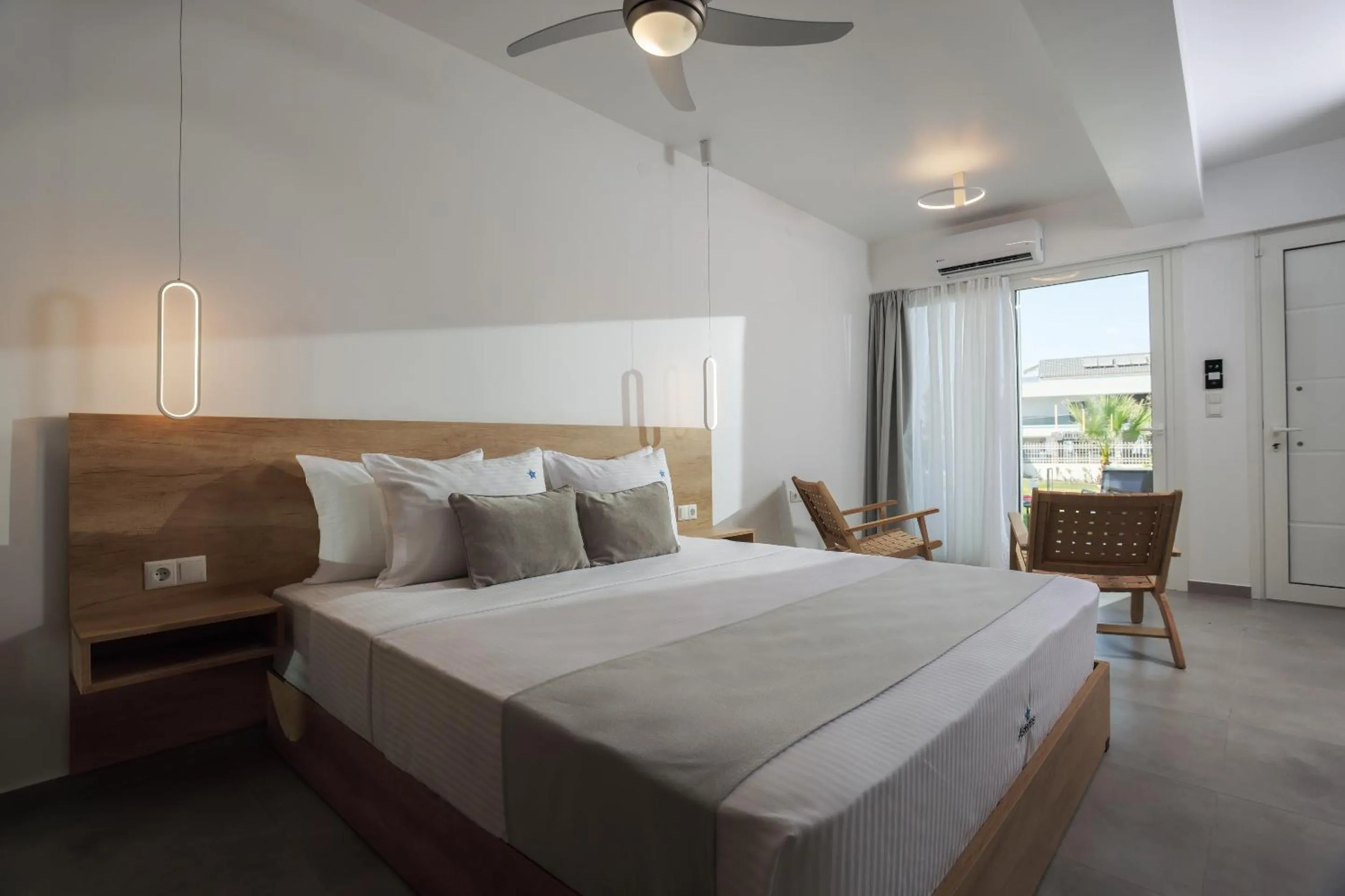 Bed in Asterias Premium Holiday Apartments