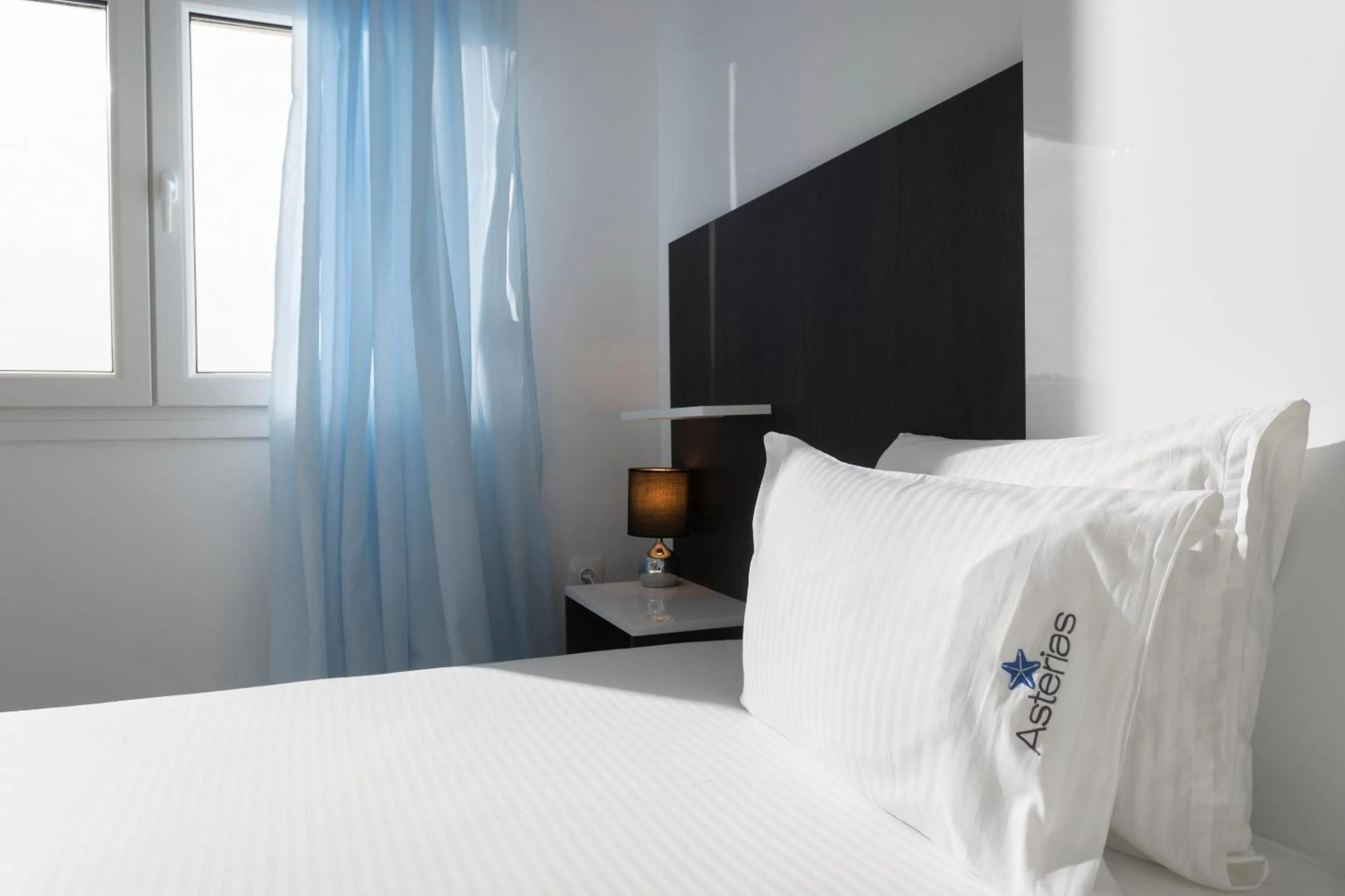 Bed in Asterias Premium Holiday Apartments