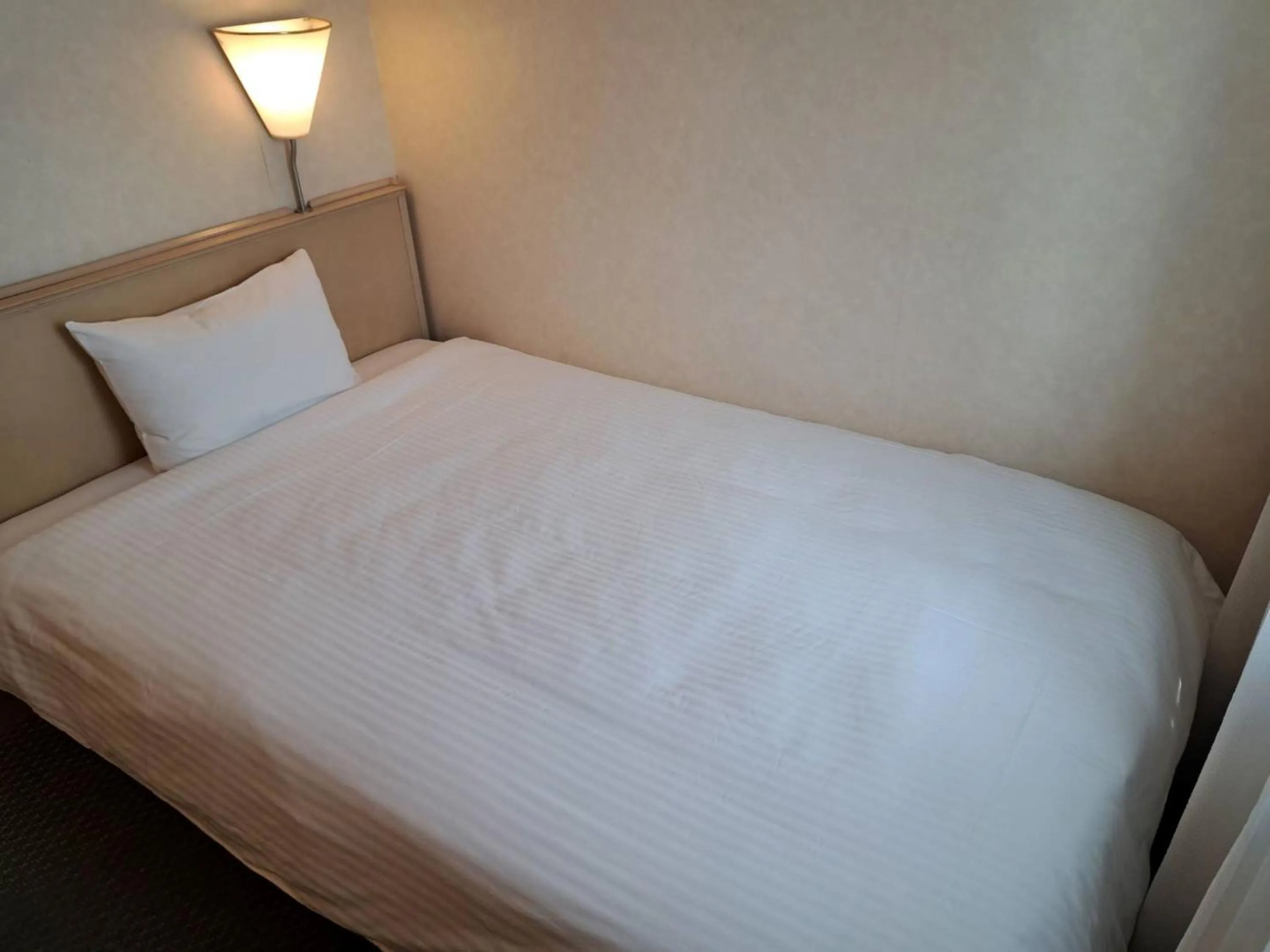 Photo of the whole room, Bed in Tabist Hotel Tetora Kitakyushu