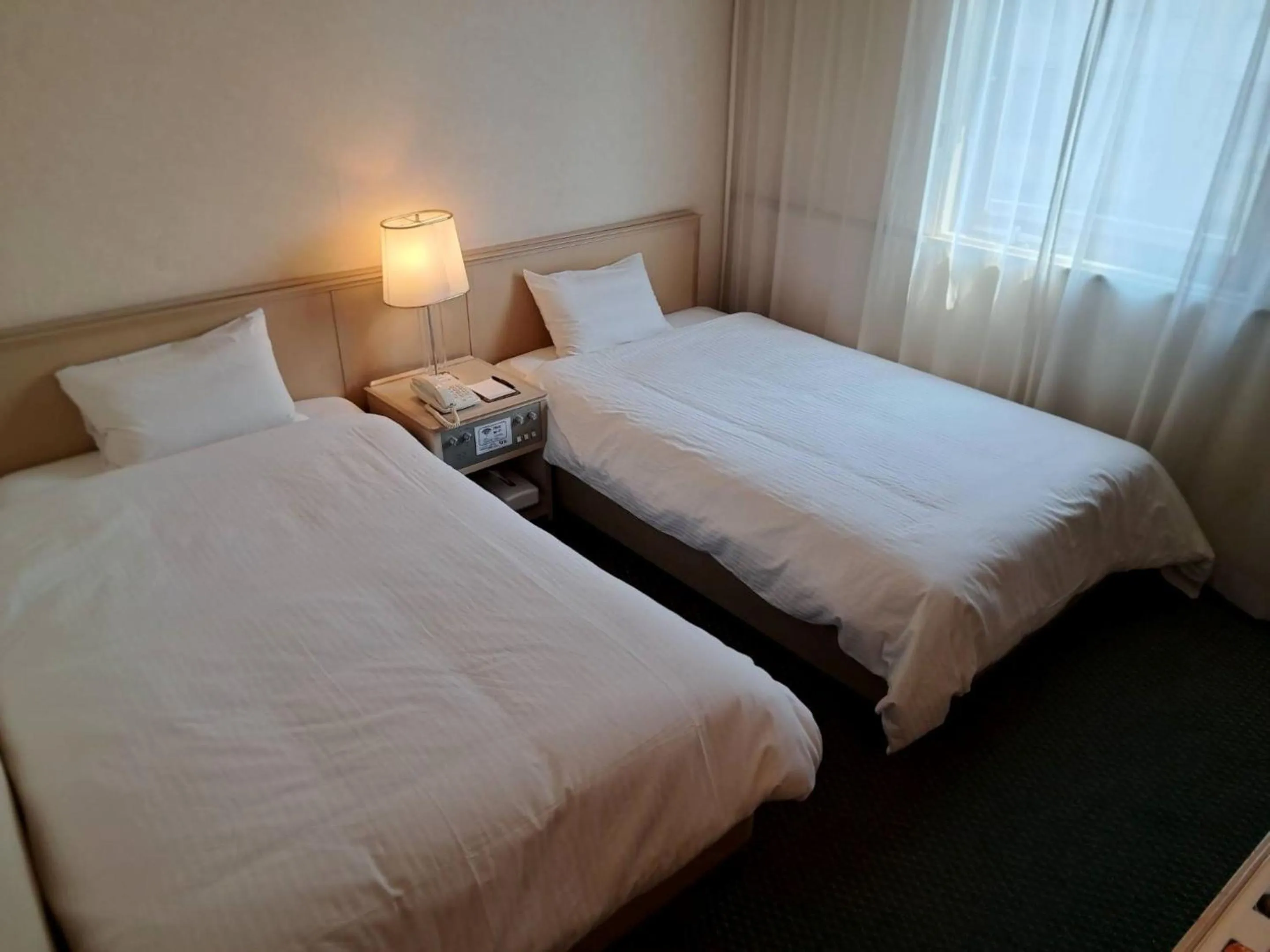 Photo of the whole room, Bed in Tabist Hotel Tetora Kitakyushu