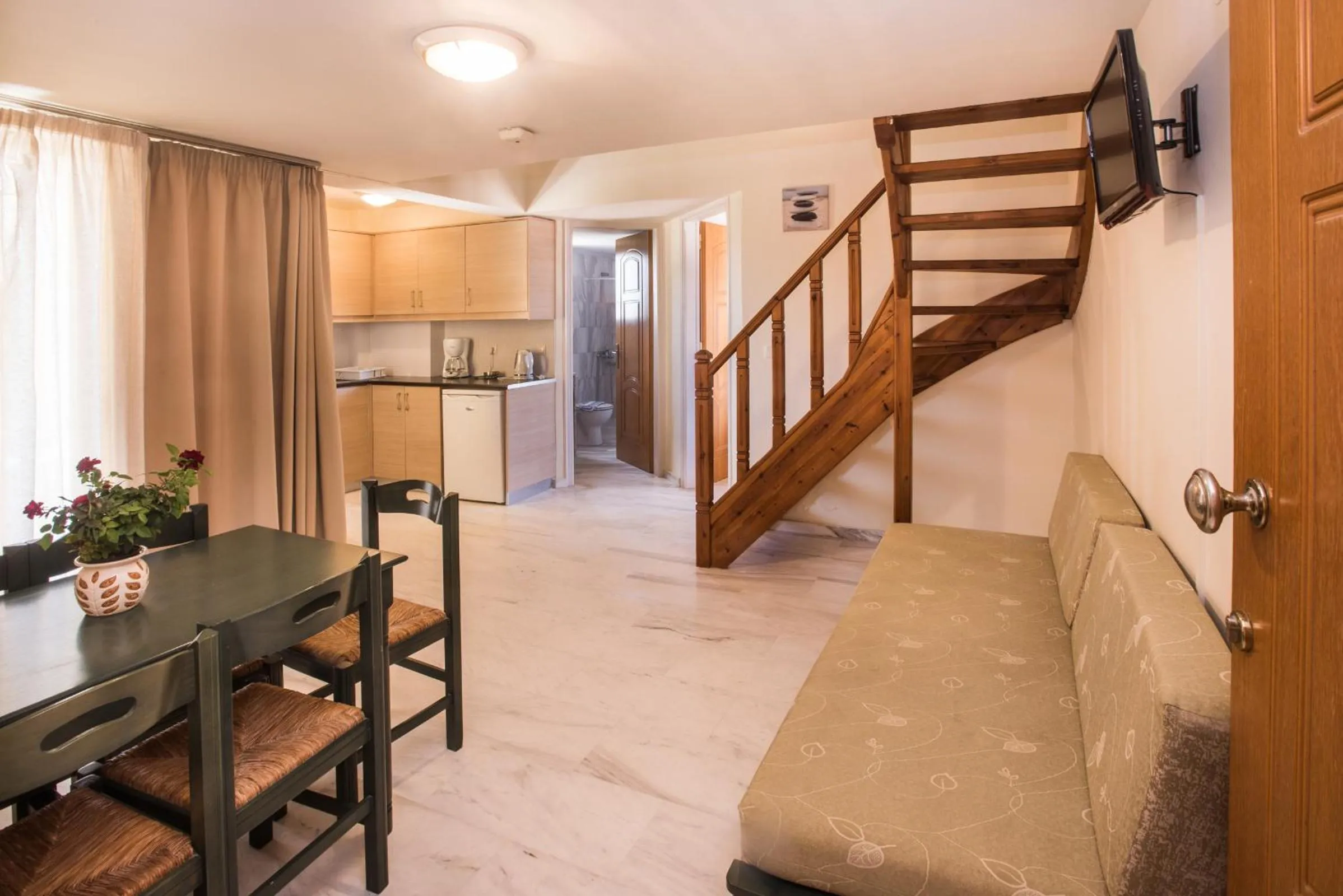 Living room in Mythos Beach Hotel Apartments