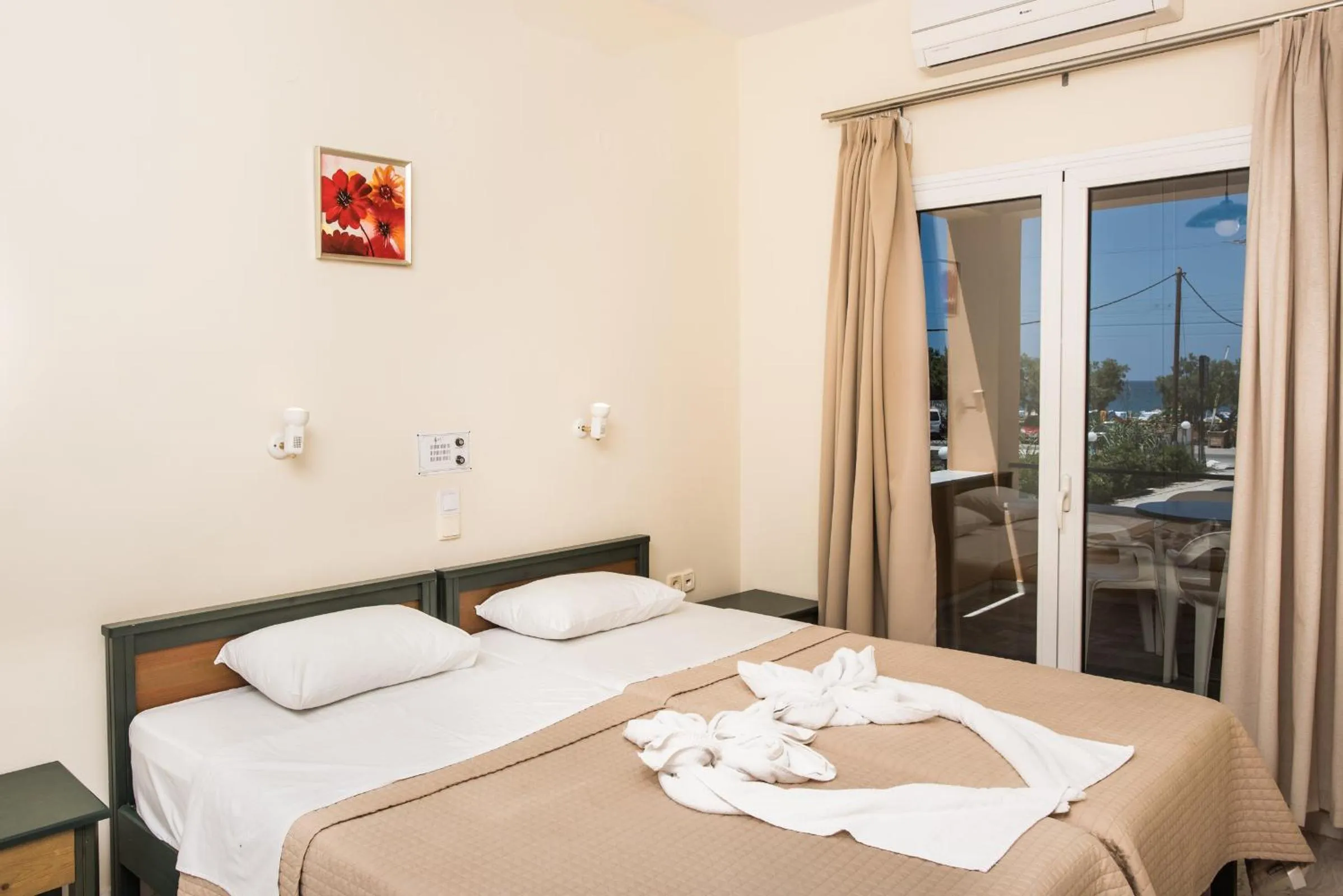 Bed in Mythos Beach Hotel Apartments