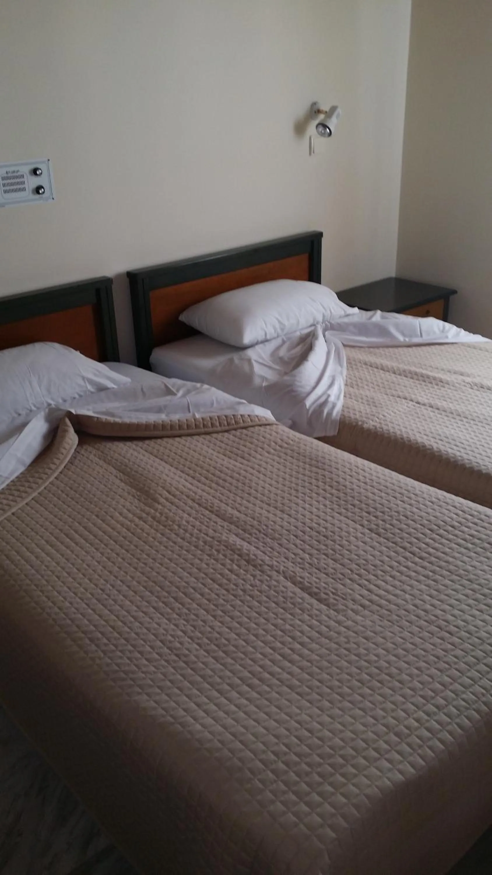 Bed in Mythos Beach Hotel Apartments