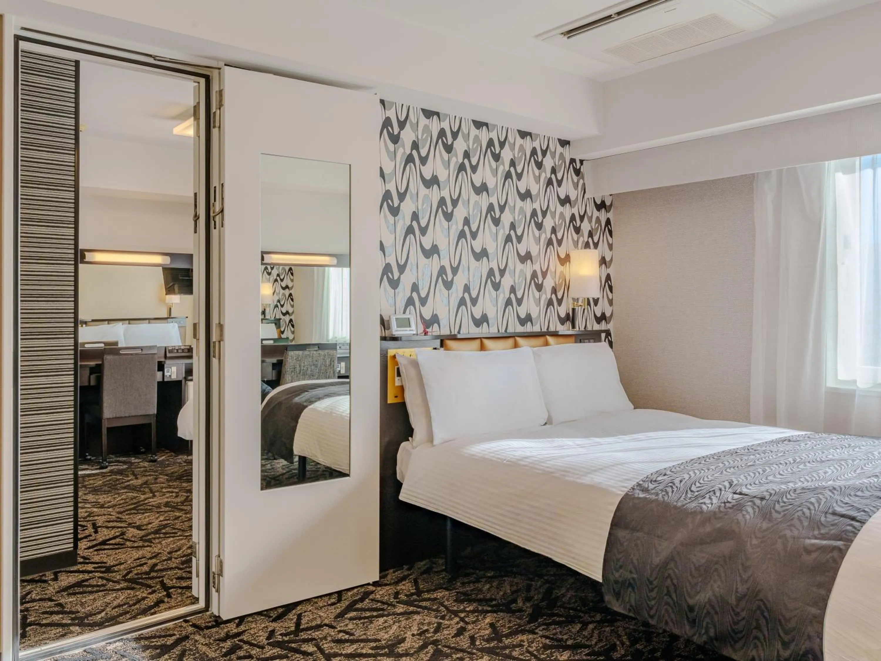 Photo of the whole room, Bed in APA Hotel Naha Matsuyama