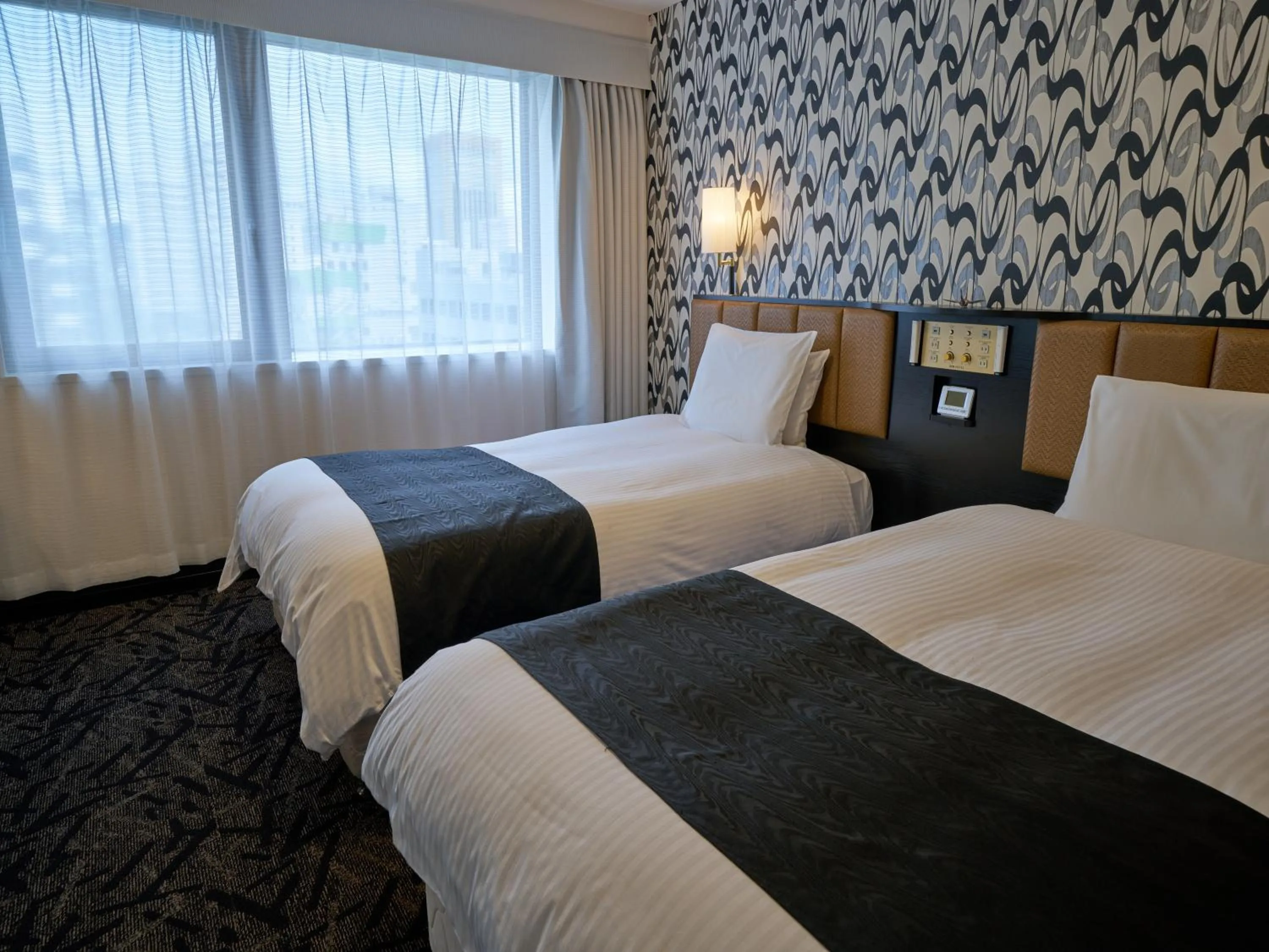 Photo of the whole room, Bed in APA Hotel Okayama Ekimae