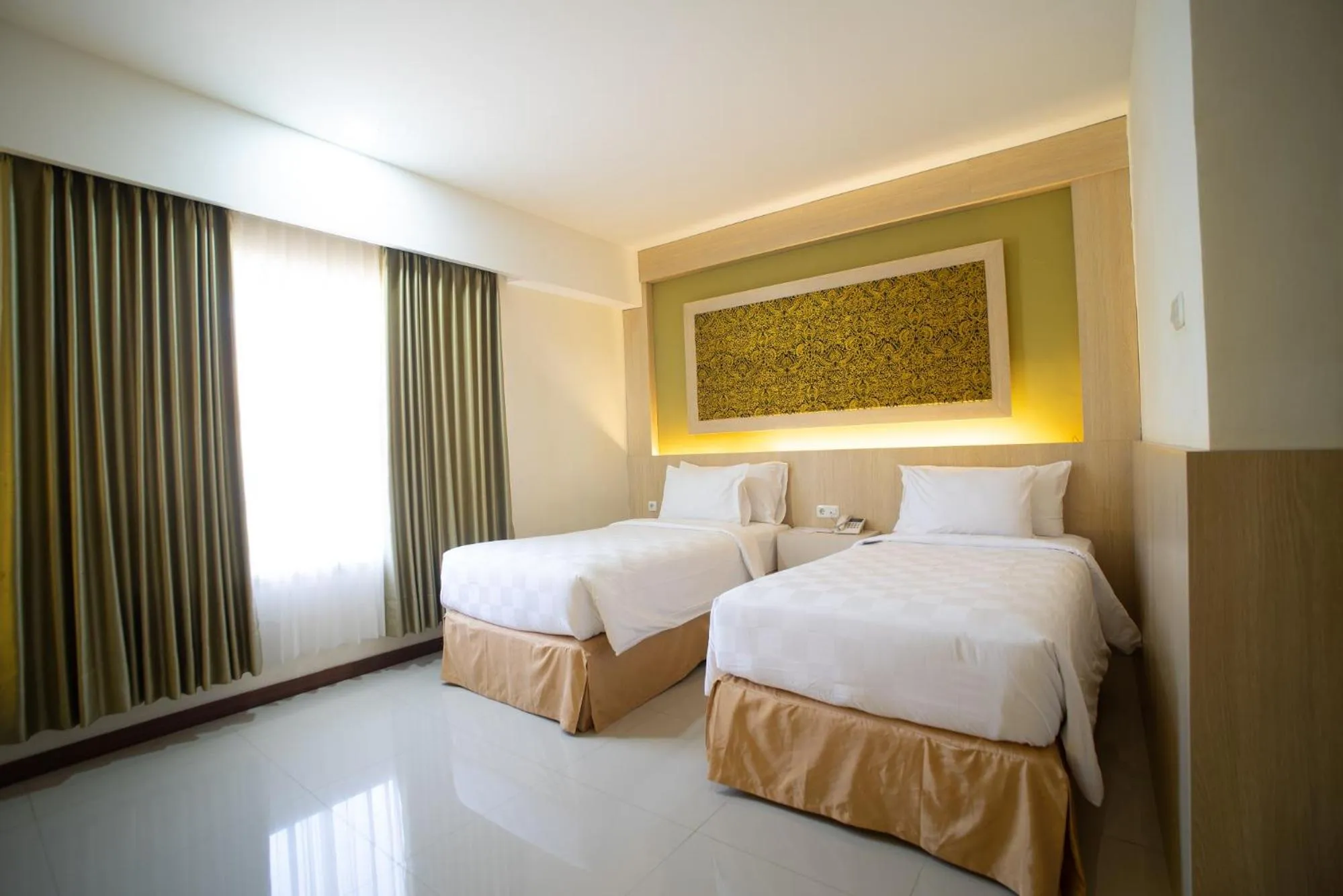 Bedroom, Bed in Luminor Hotel Banyuwangi By WH
