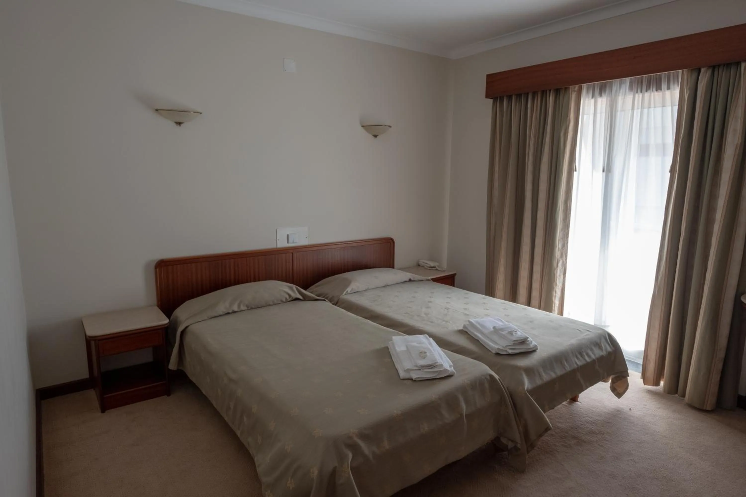 Bed in Hotel Peregrinos de Fatima by Umbral