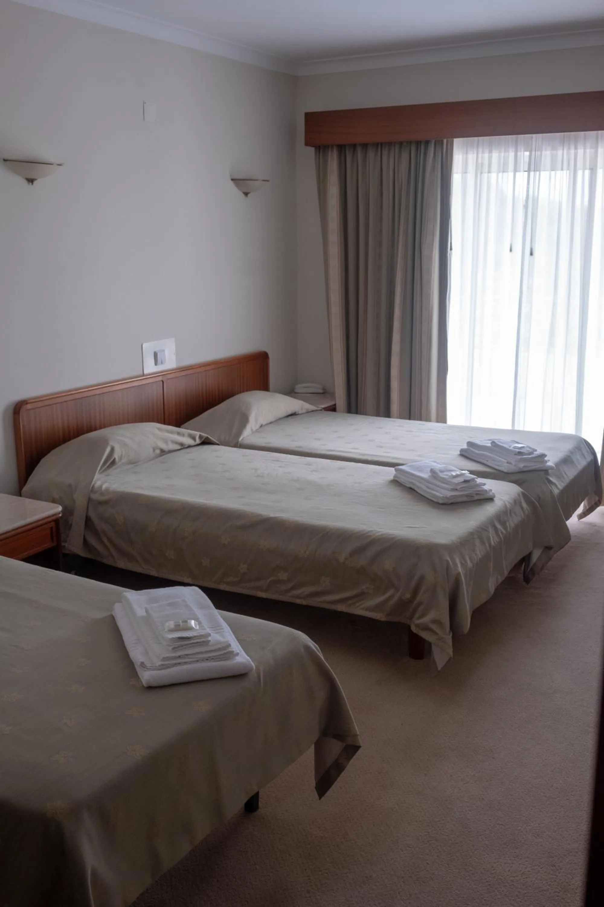 Bed in Hotel Peregrinos de Fatima by Umbral