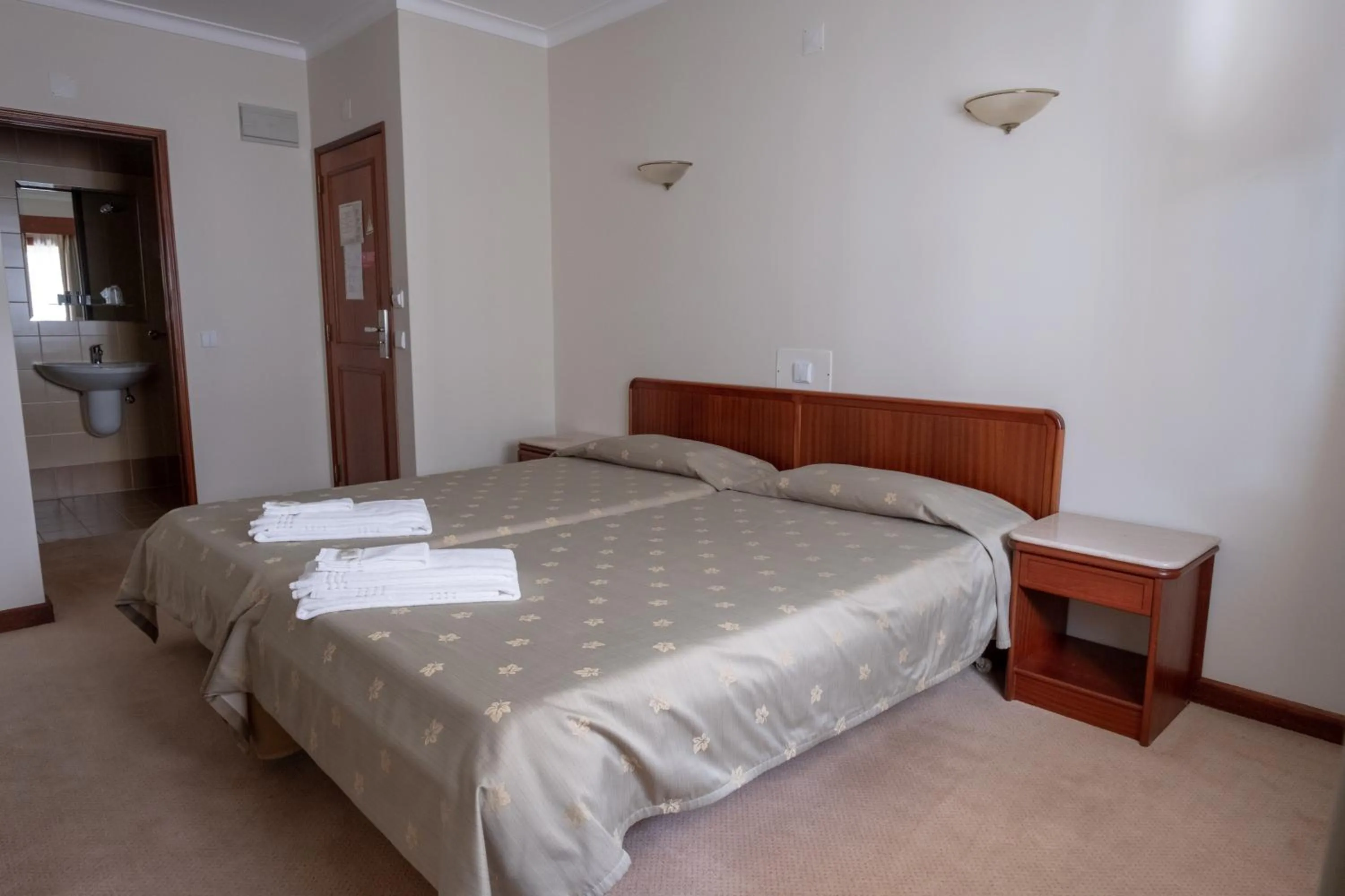 Bed in Hotel Peregrinos de Fatima by Umbral