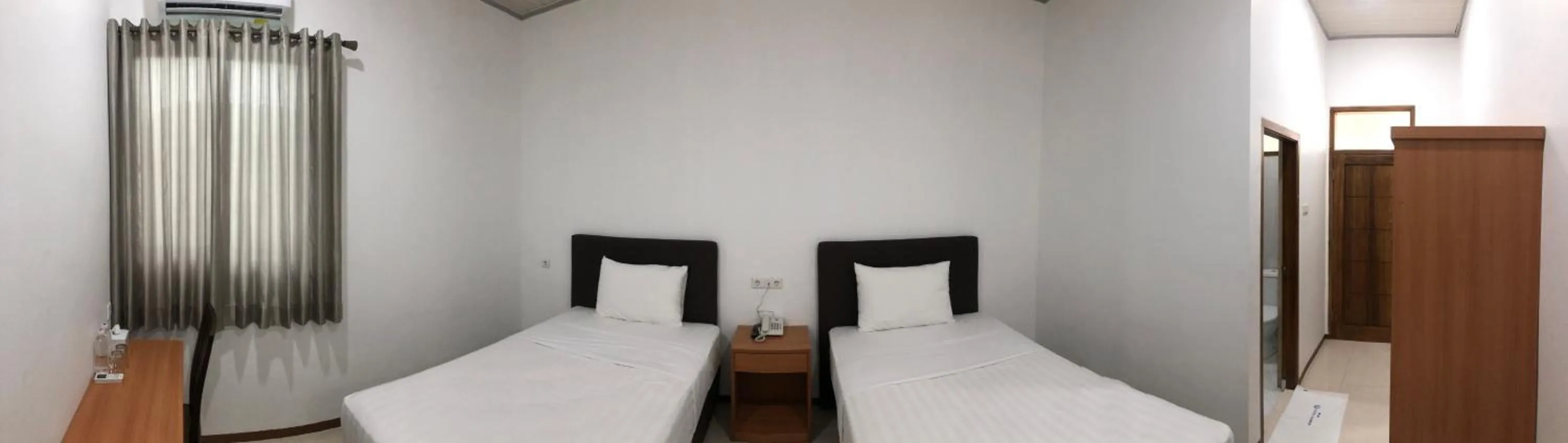 Bed in Aurora Hotel Siliwangi