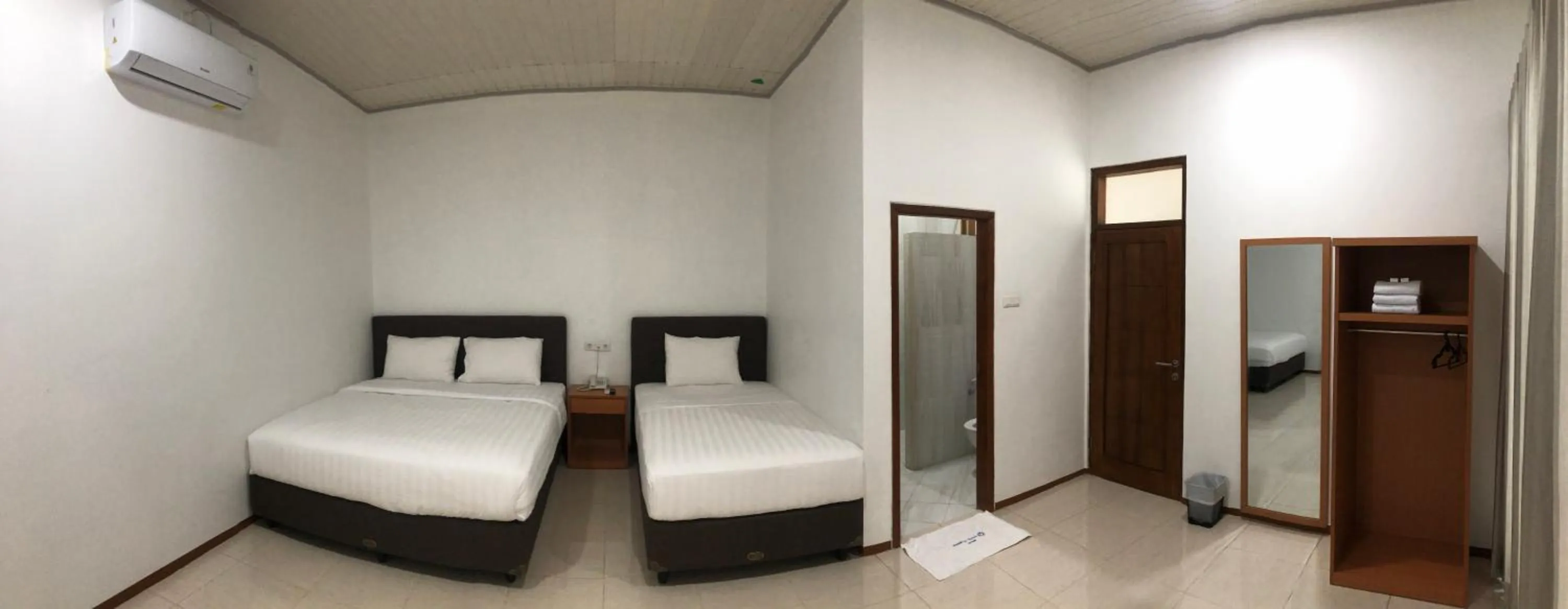 Bed in Aurora Hotel Siliwangi