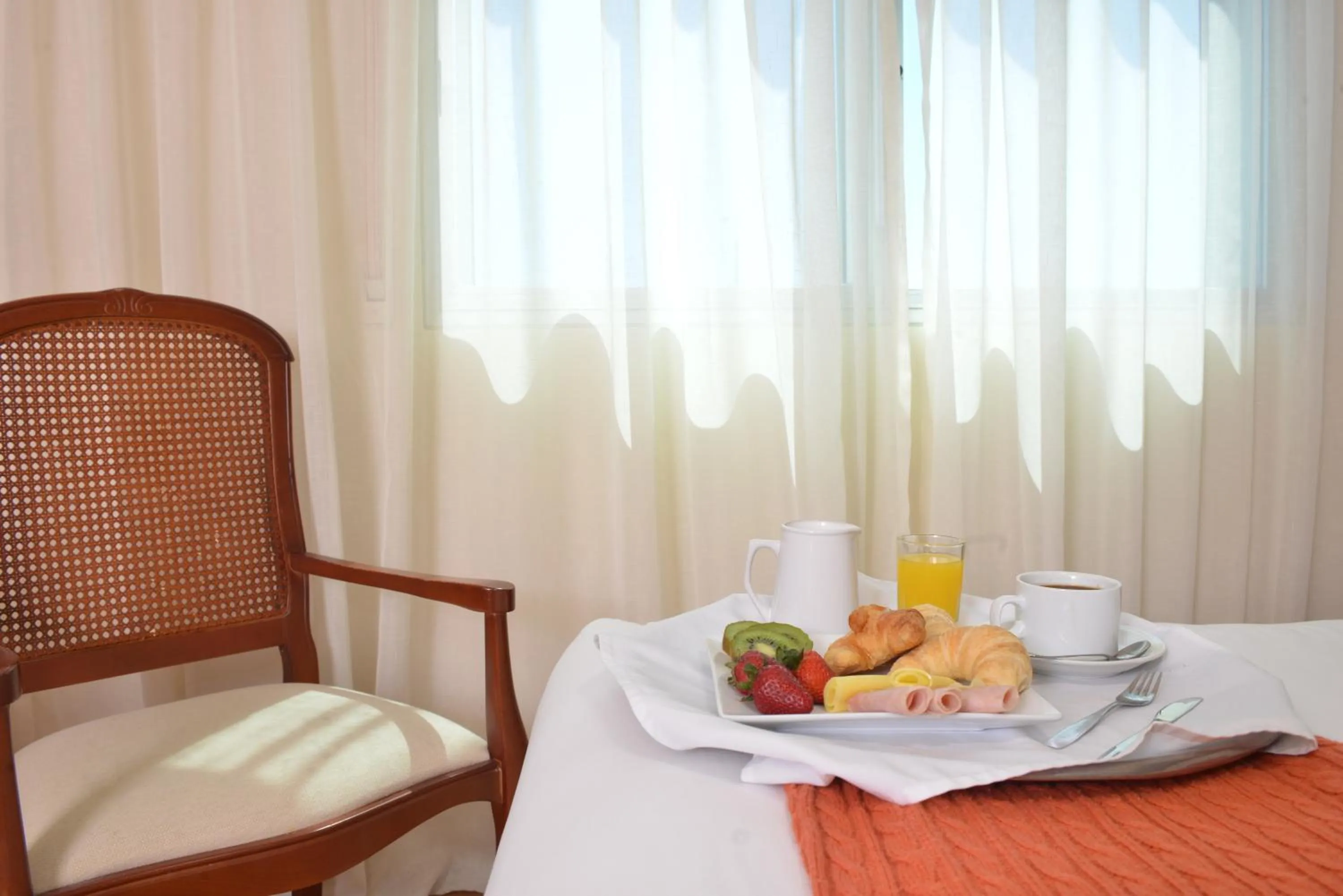 Bed in Hotel Sunset Beach