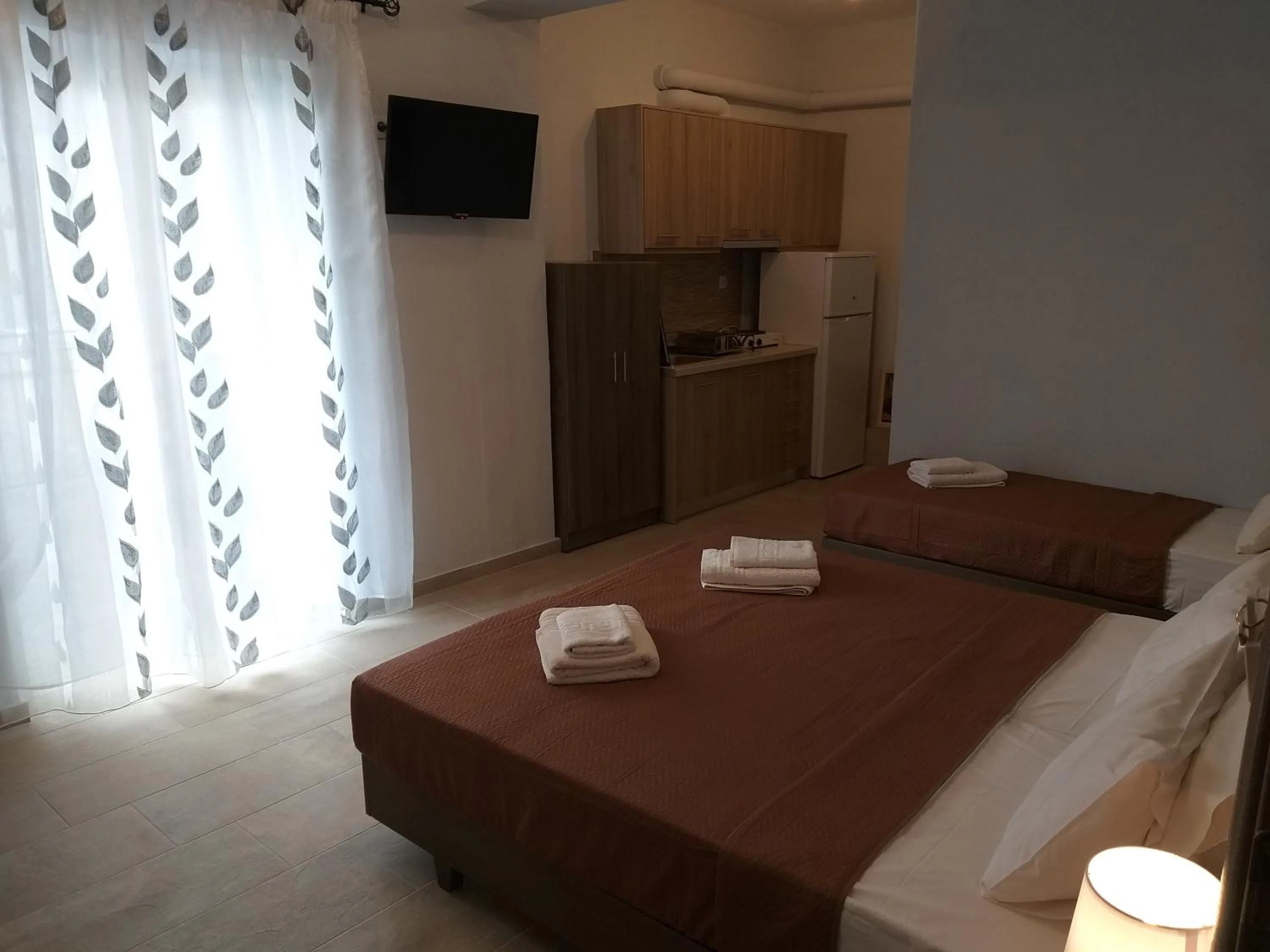 Bed in Nostos Apartments
