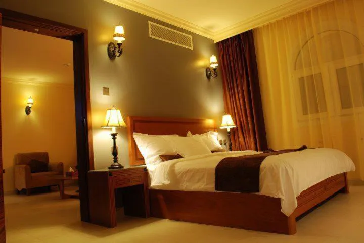 Bed in La Rosa Hotel Oman