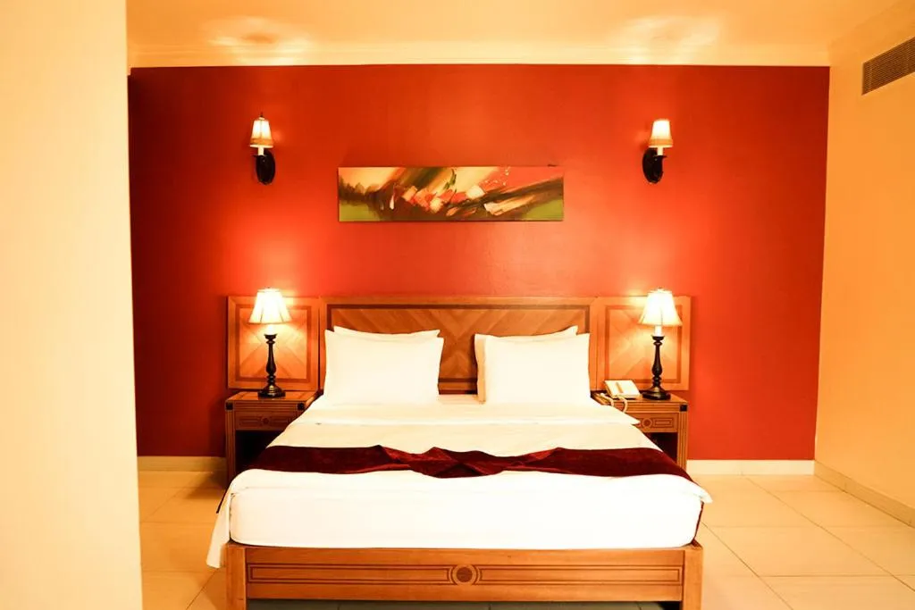 Bed in La Rosa Hotel Oman