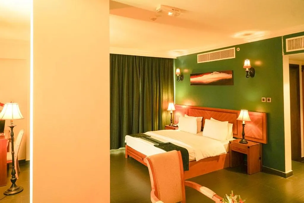 Bed in La Rosa Hotel Oman