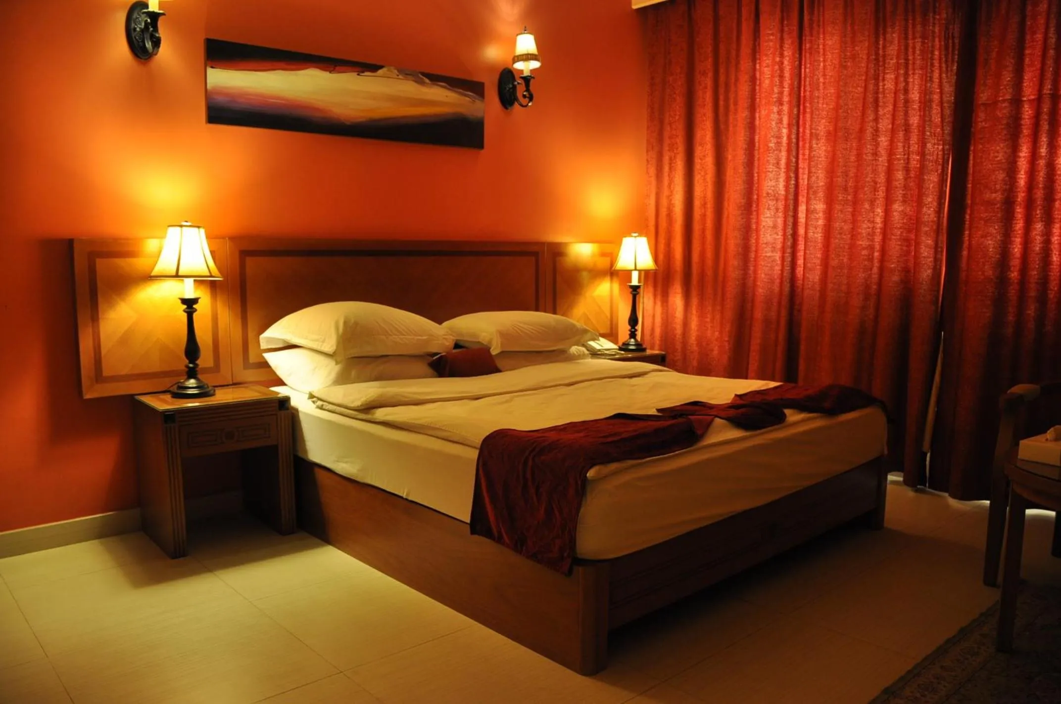 Bed in La Rosa Hotel Oman