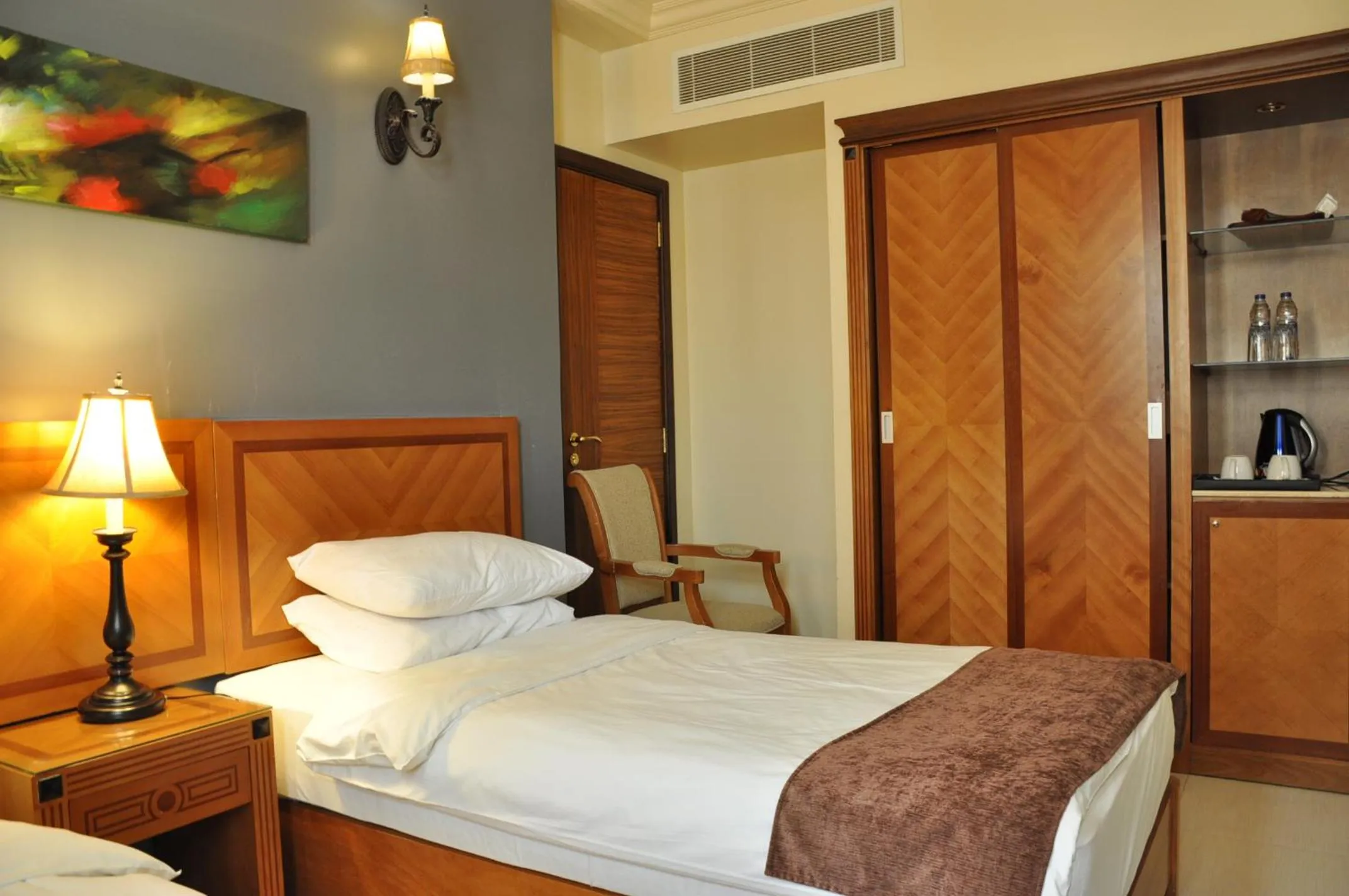 Bed in La Rosa Hotel Oman