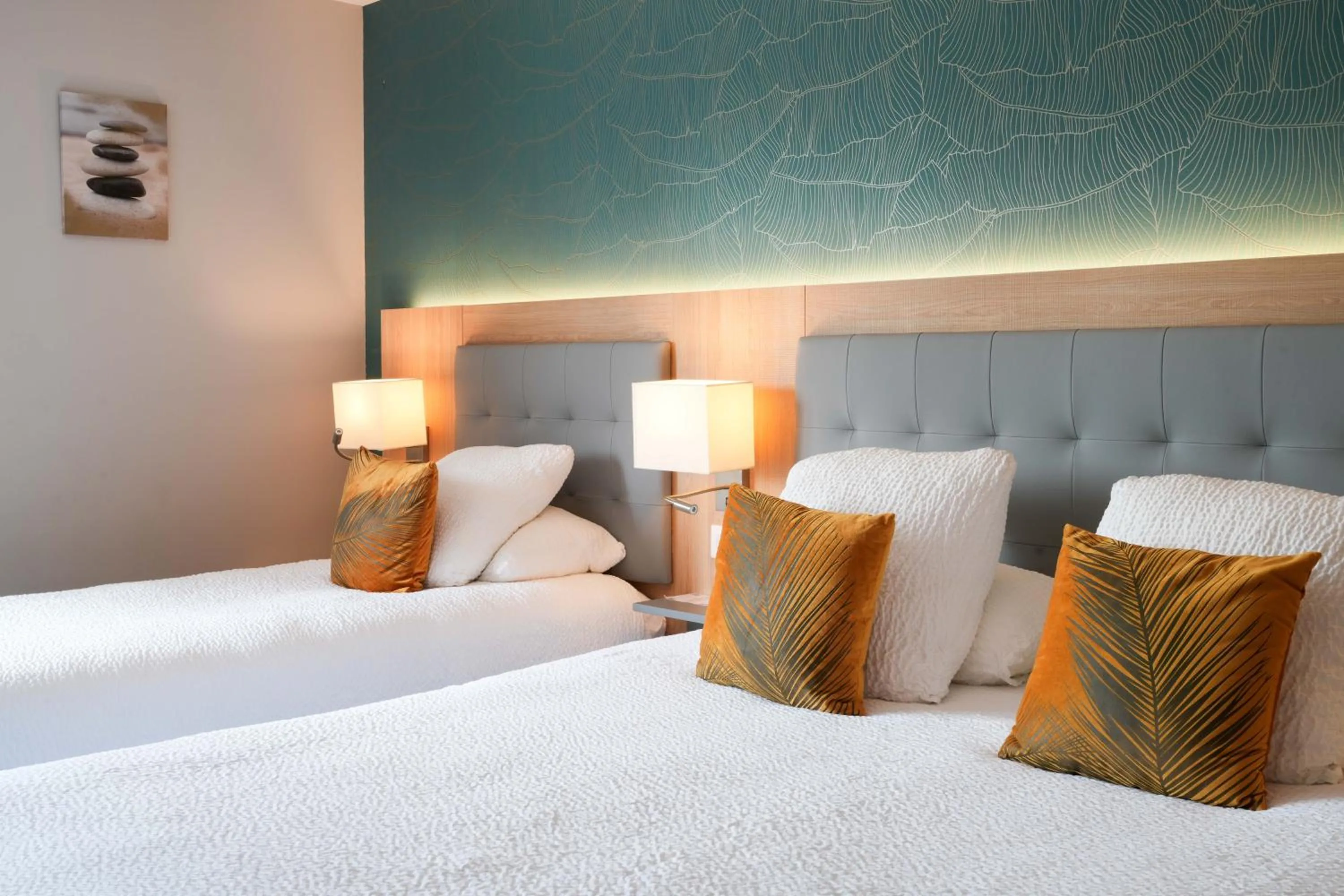 Bed in Logis Hôtel l'Amandier