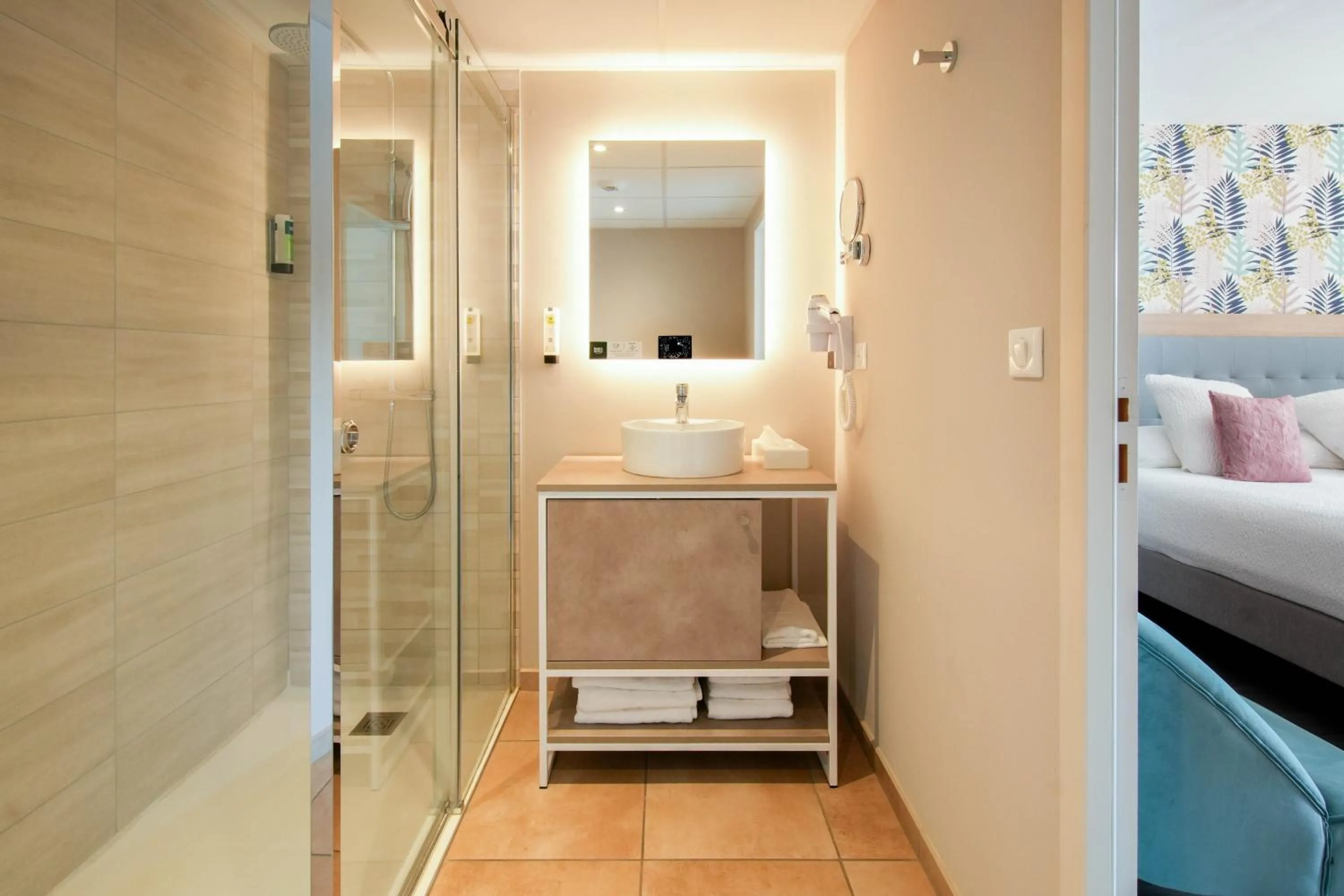 Bed in Logis Hôtel l'Amandier