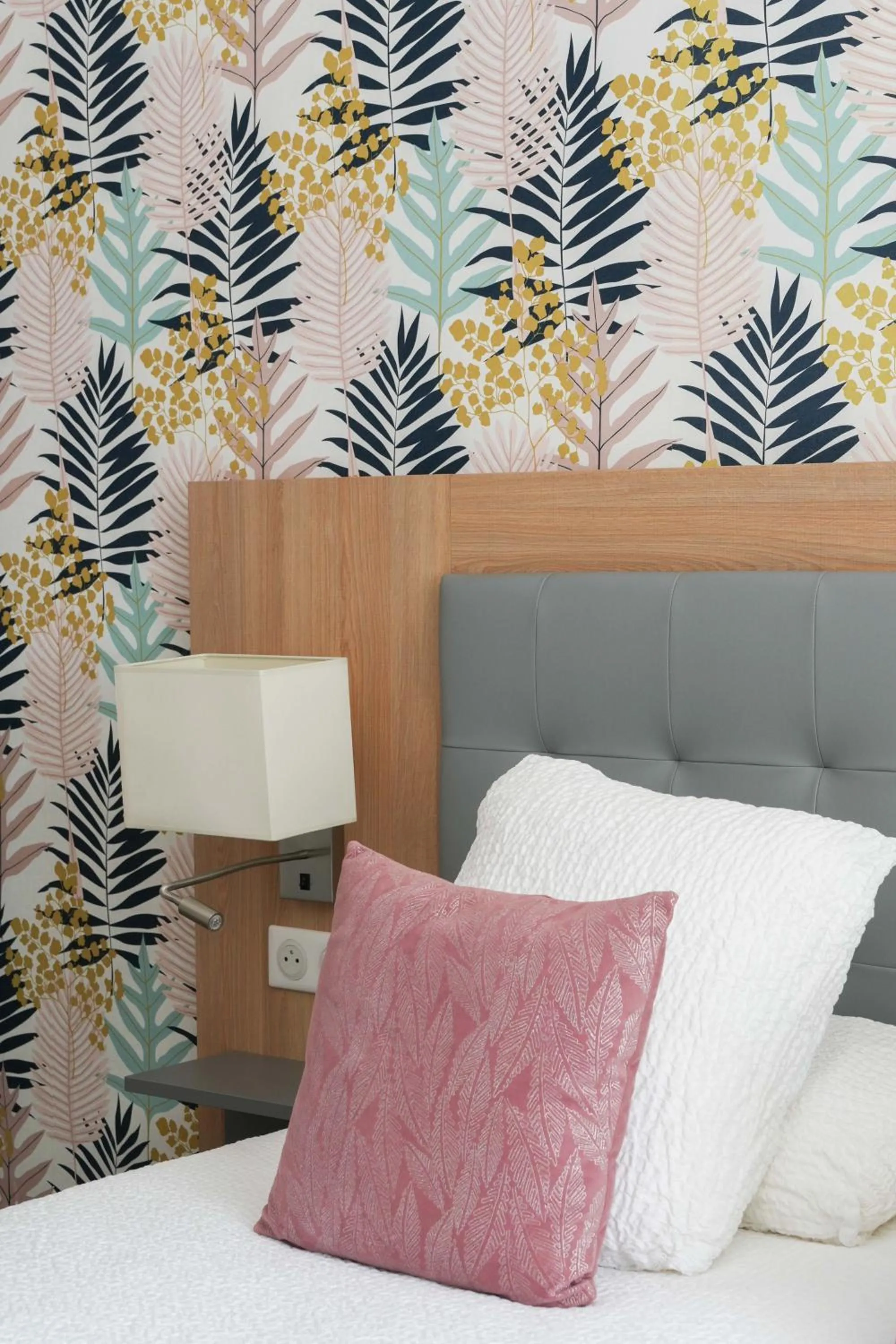 Bed in Logis Hôtel l'Amandier