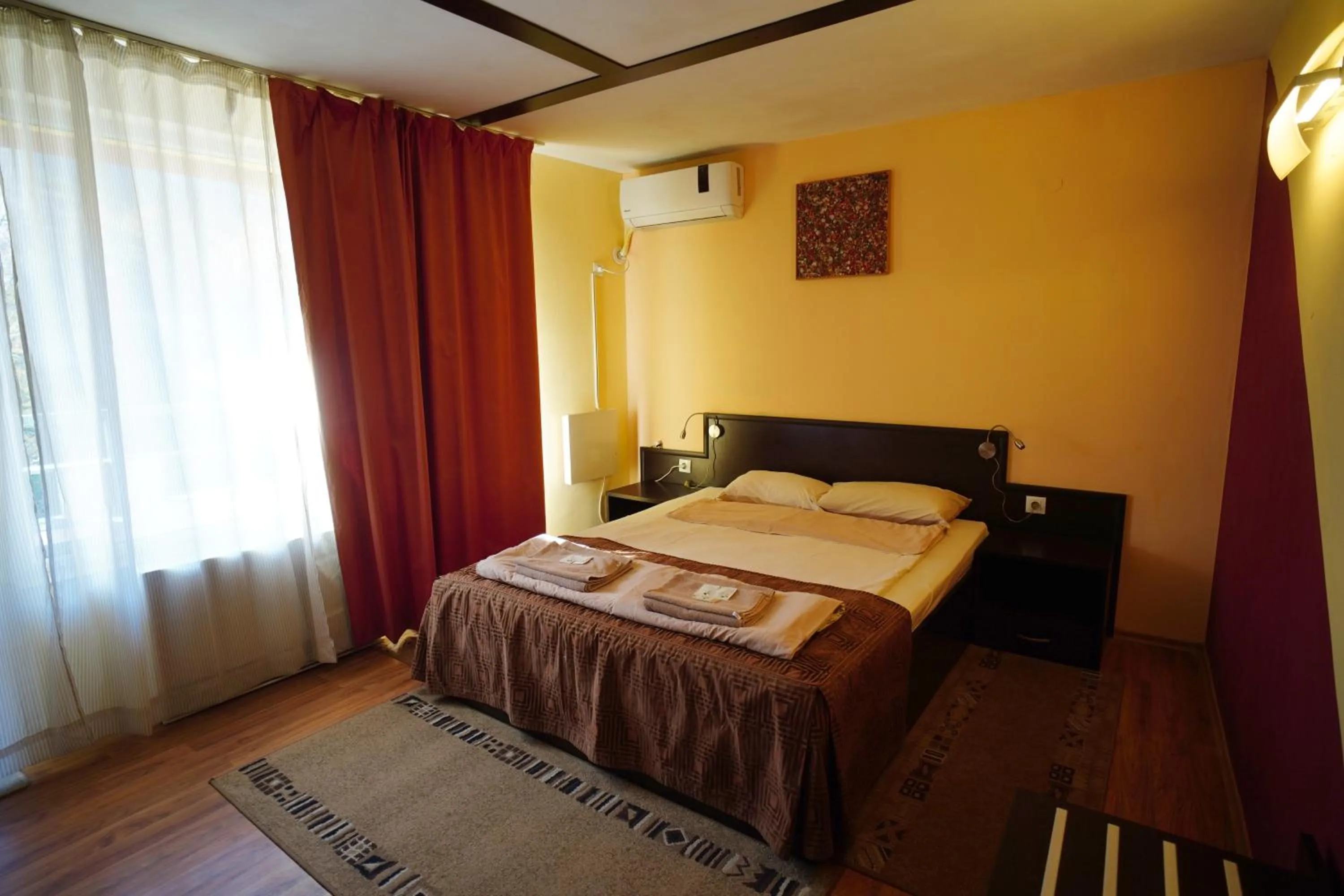 Bed in Family Art-Hotel Zora