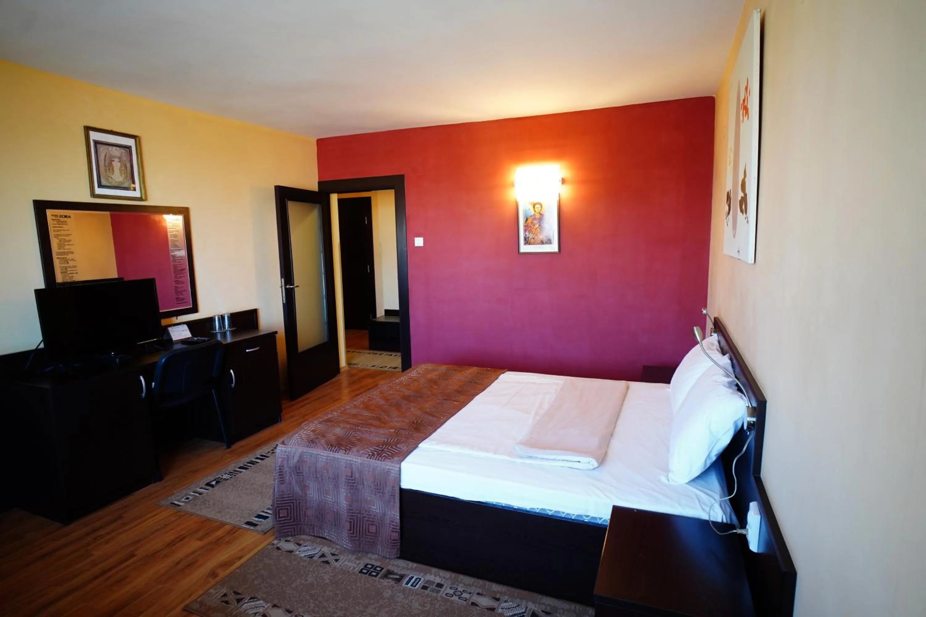 Bed in Family Art-Hotel Zora