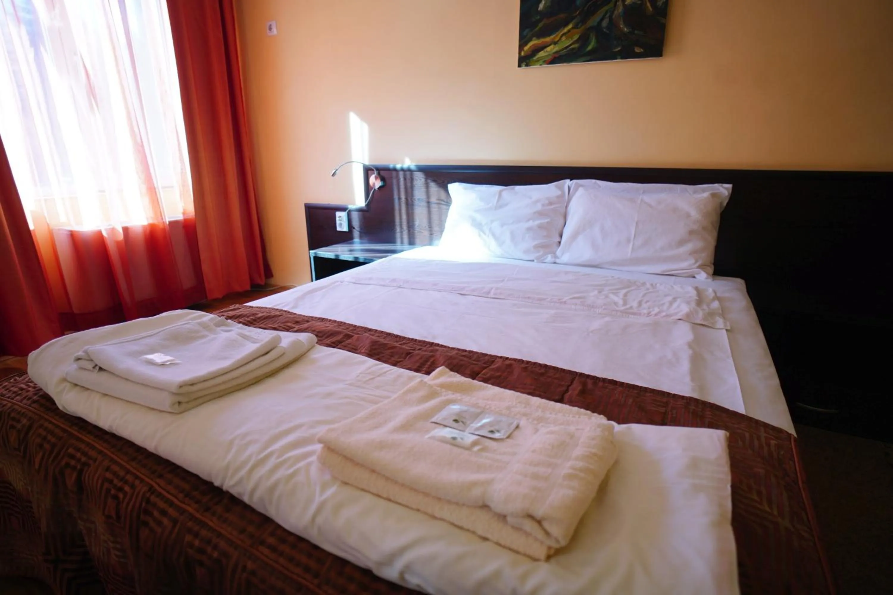 Bed in Family Art-Hotel Zora