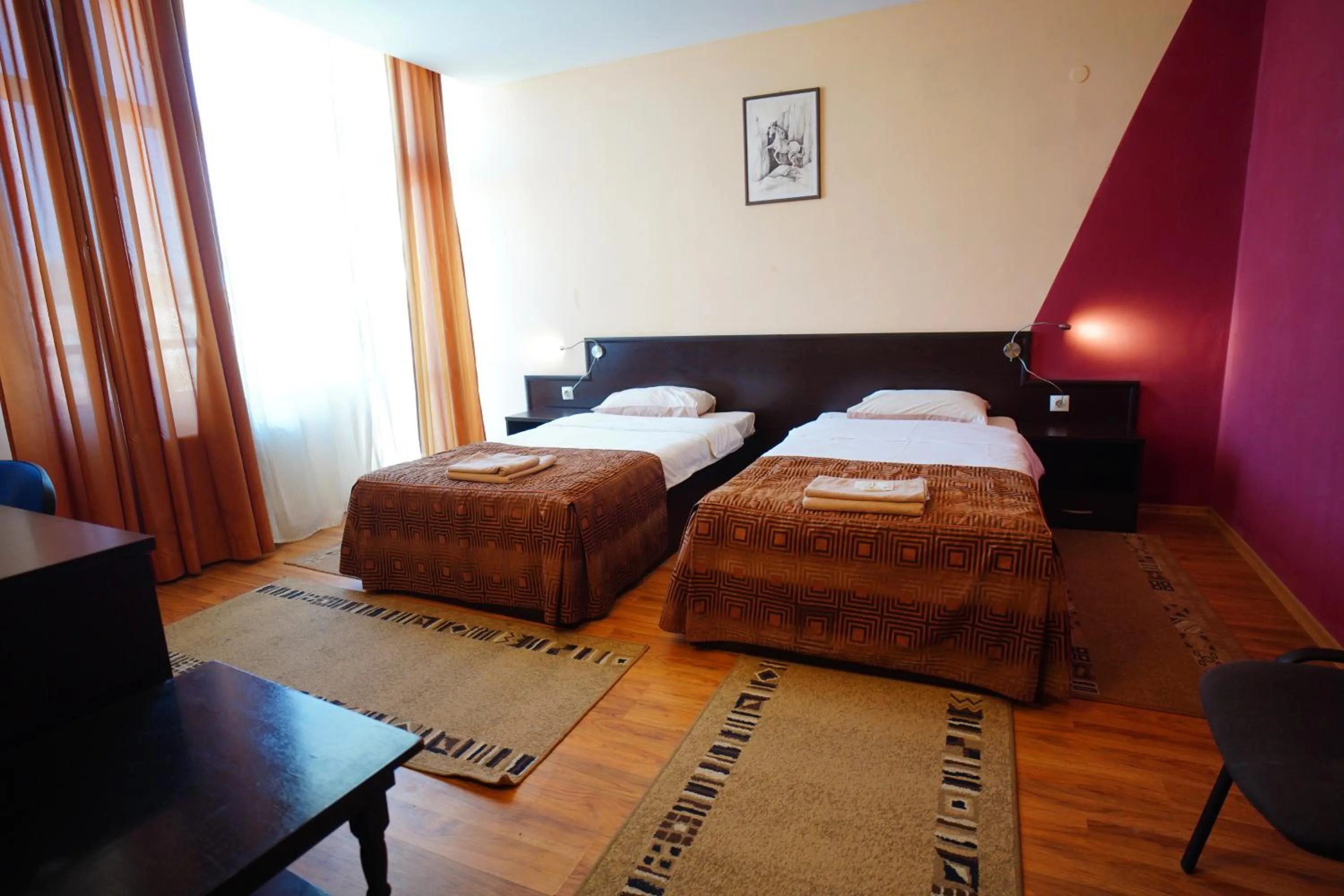 Bed in Family Art-Hotel Zora