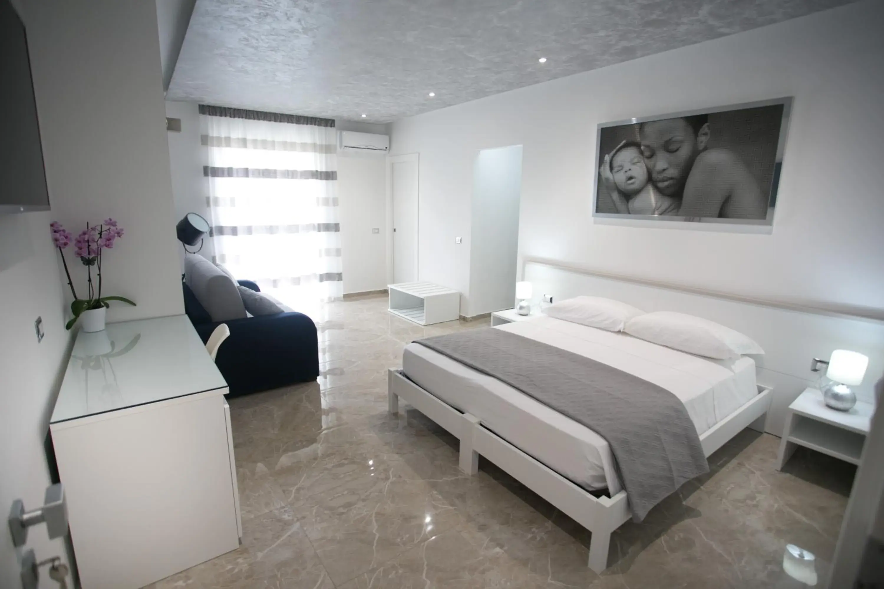 Deluxe Quadruple Room in Tropea Luxury & Charm Deluxe Quadruple Room in Tropea Luxury & Charm